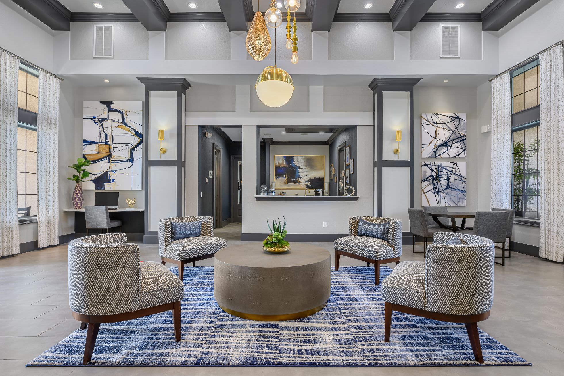 Lobby entrance with sitting area and a large rug at Marquis Lakeline Station in Austin, Texas