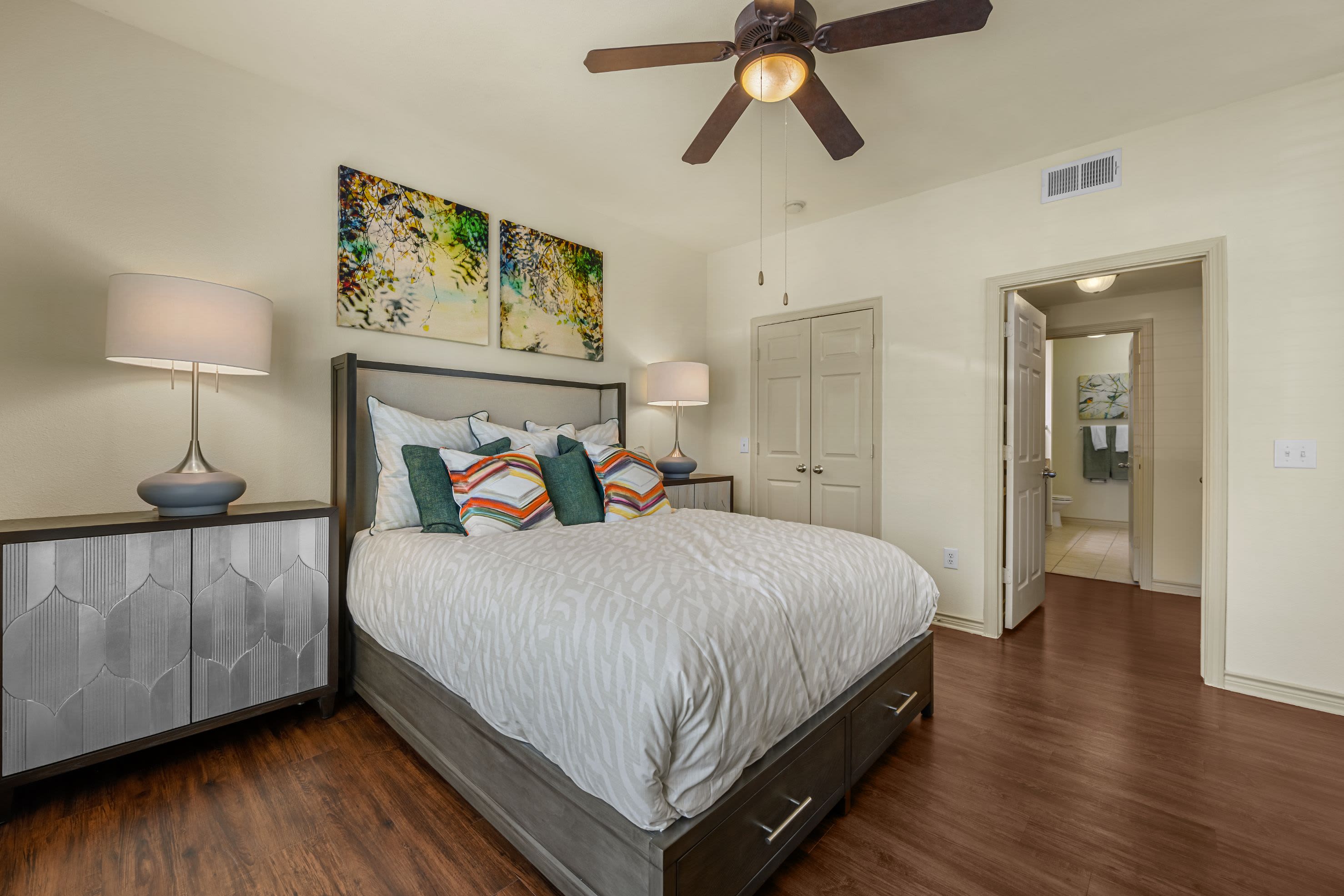 Bedroom with wood style floors and ceiling fan at Marquis Lakeline Station in Austin, Texas