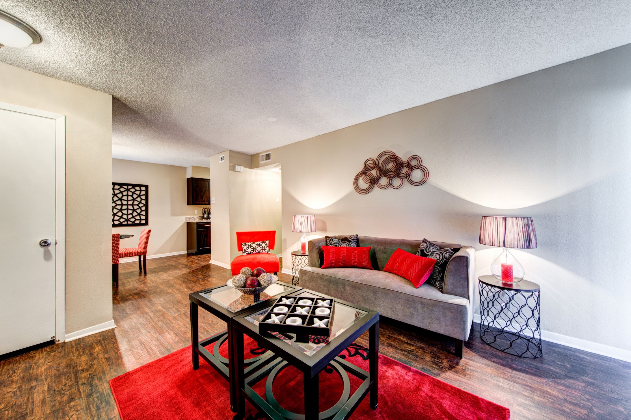 Bright living area with wood flooring at The Park at Flower Mound in Flower Mound, Texas