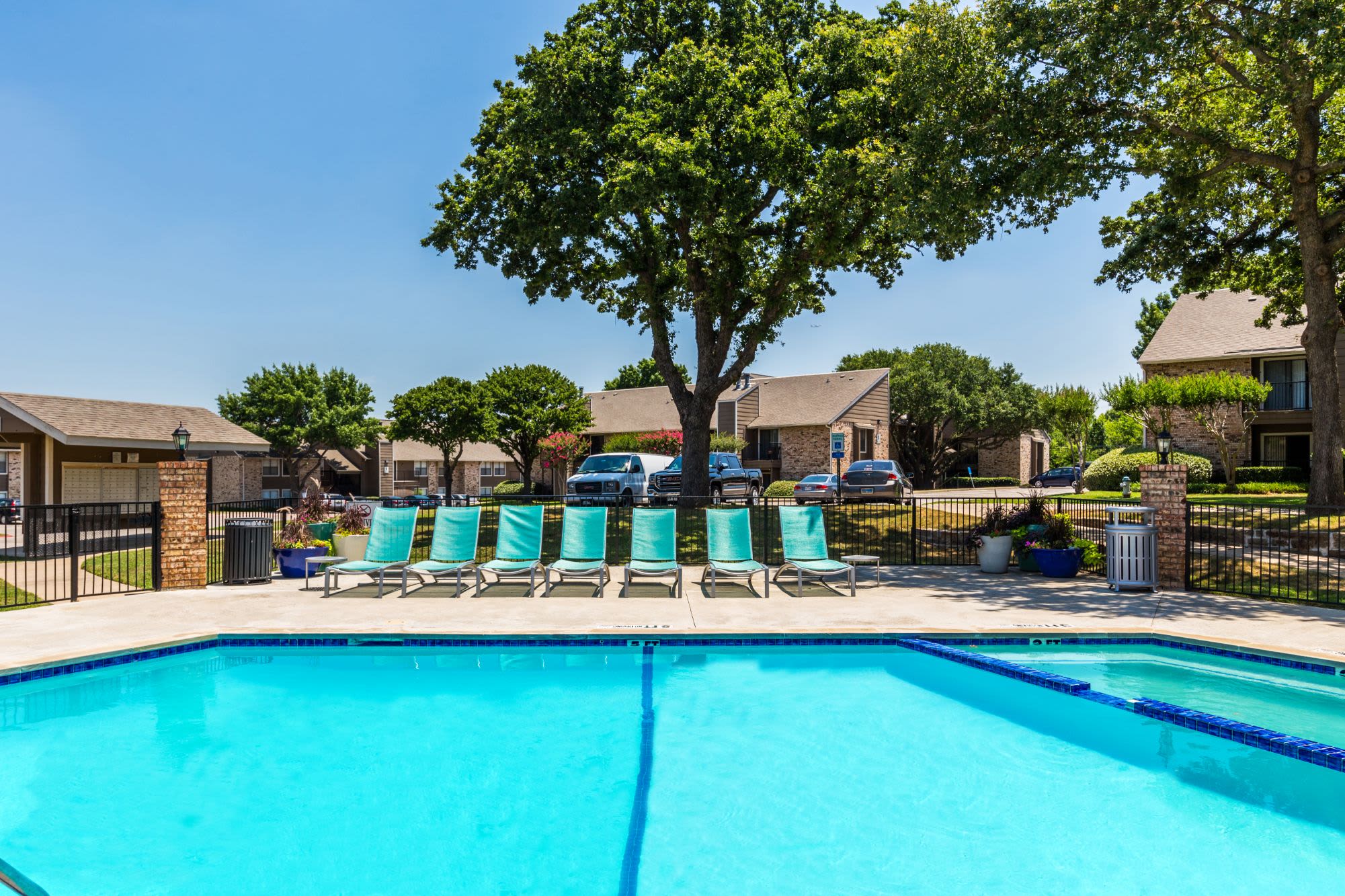 Sparkling pool with sun chairs at The Park at Flower Mound in Flower Mound, Texas