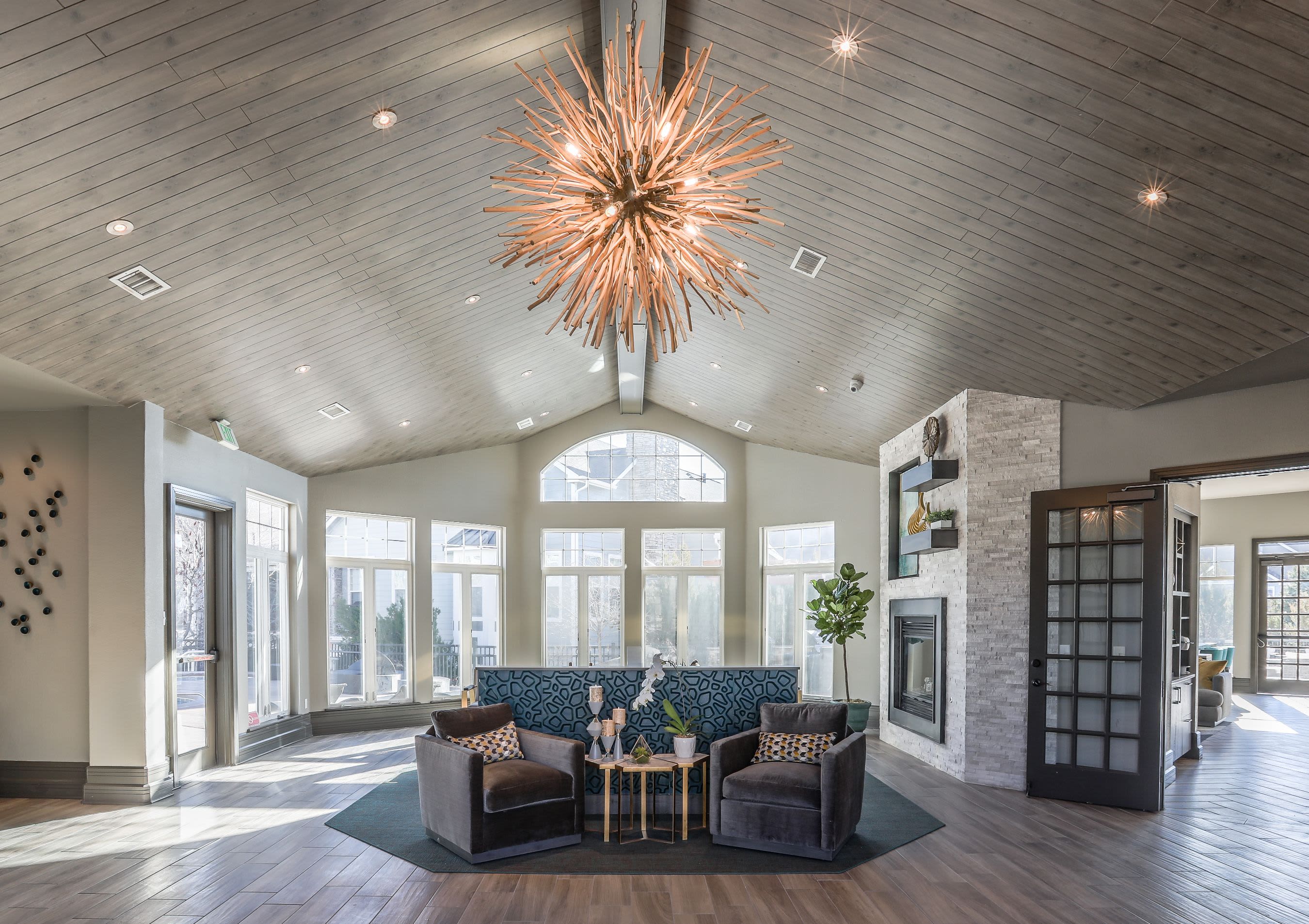 Bright lobby area with multiple large windows at Marquis Castle Pines in Castle Pines, Colorado