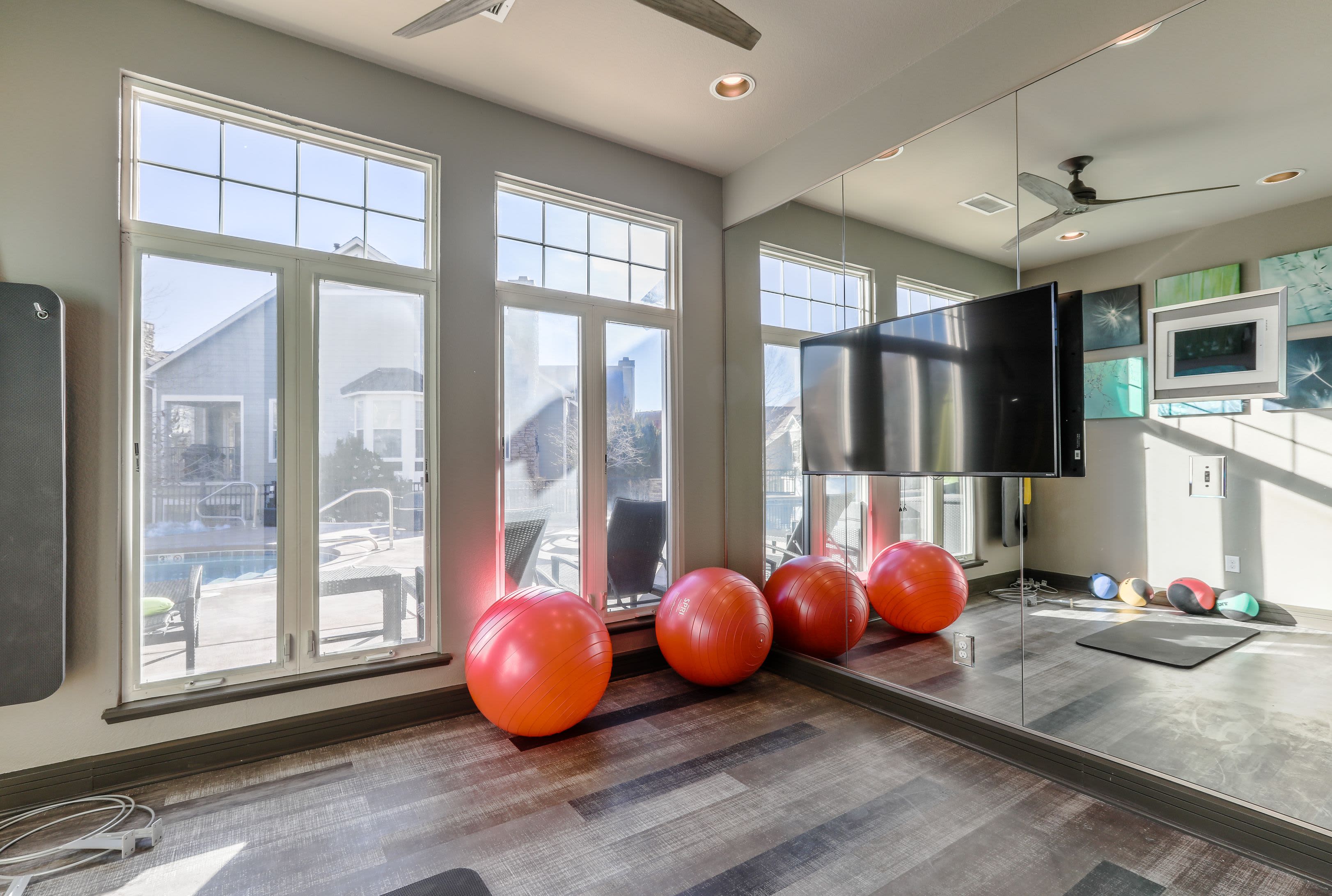 Yoga balls and large mirror in fitness center at Marquis Castle Pines in Castle Pines, Colorado