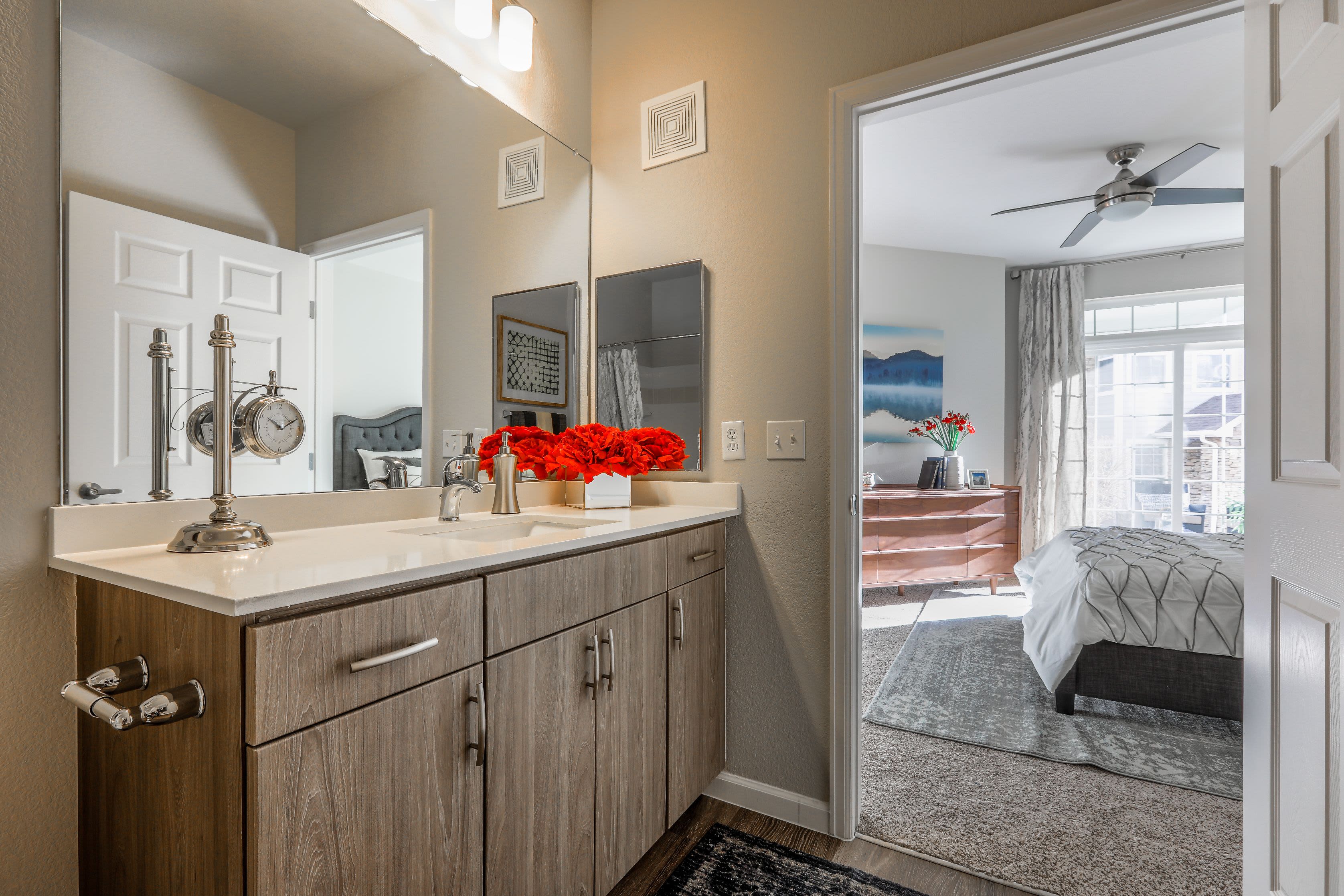 Bright bathroom with white counters at Marquis Castle Pines in Castle Pines, Colorado
