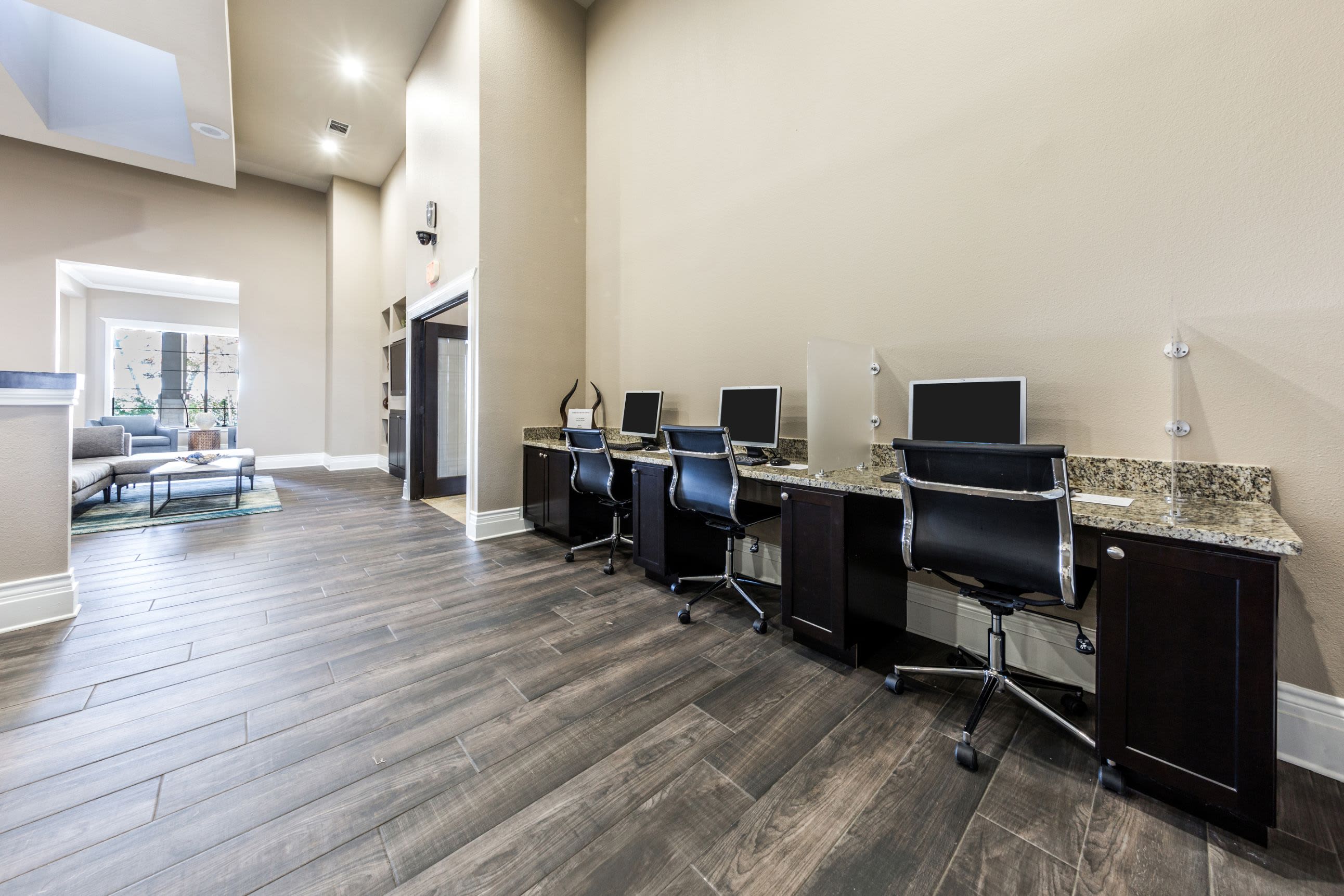 Business center with computers and office chairs at The Marquis at Brushy Creek in Austin, Texas