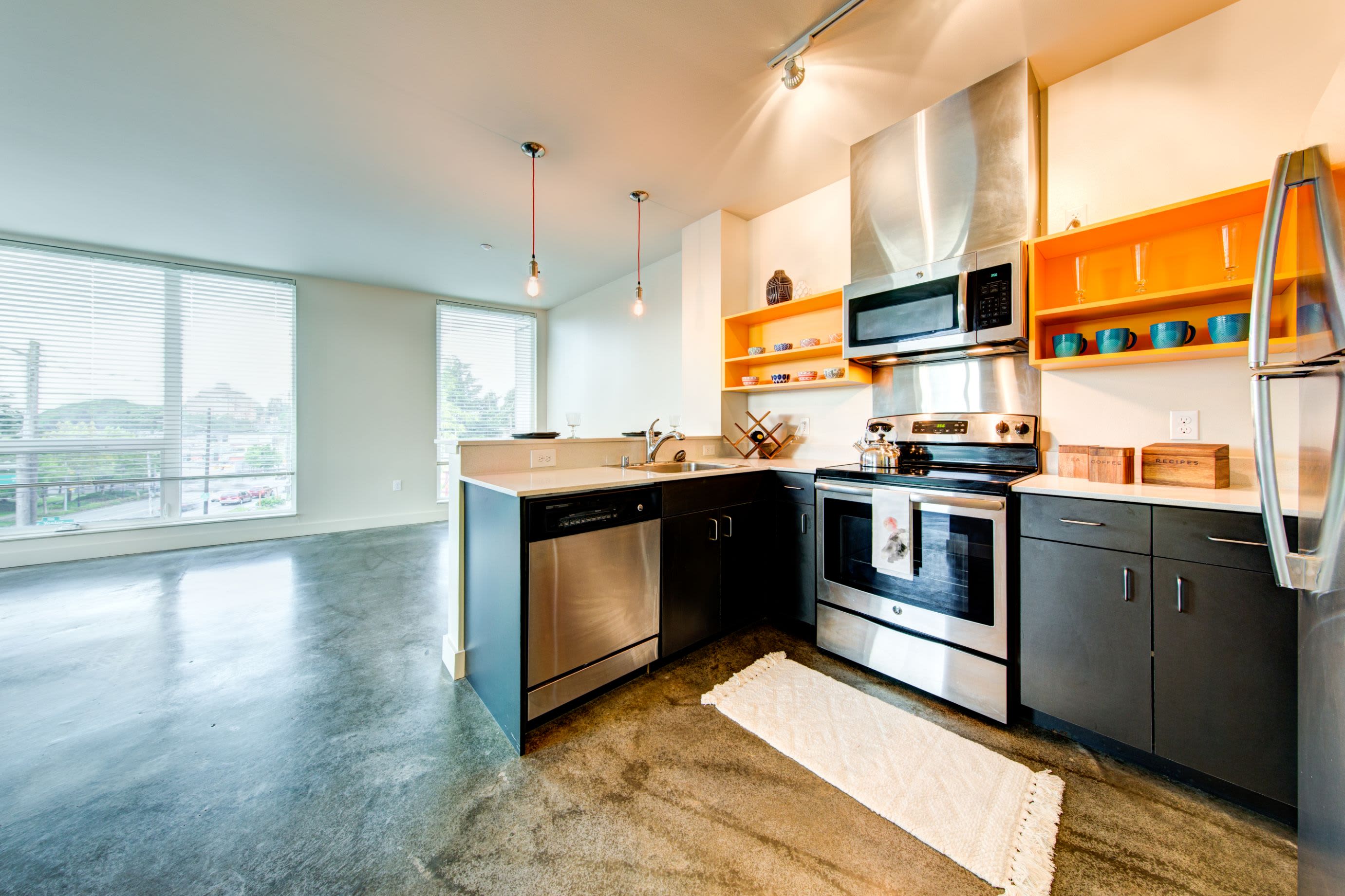 Modern kitchen with black cabinets at Anthem on 12th in Seattle, Washington