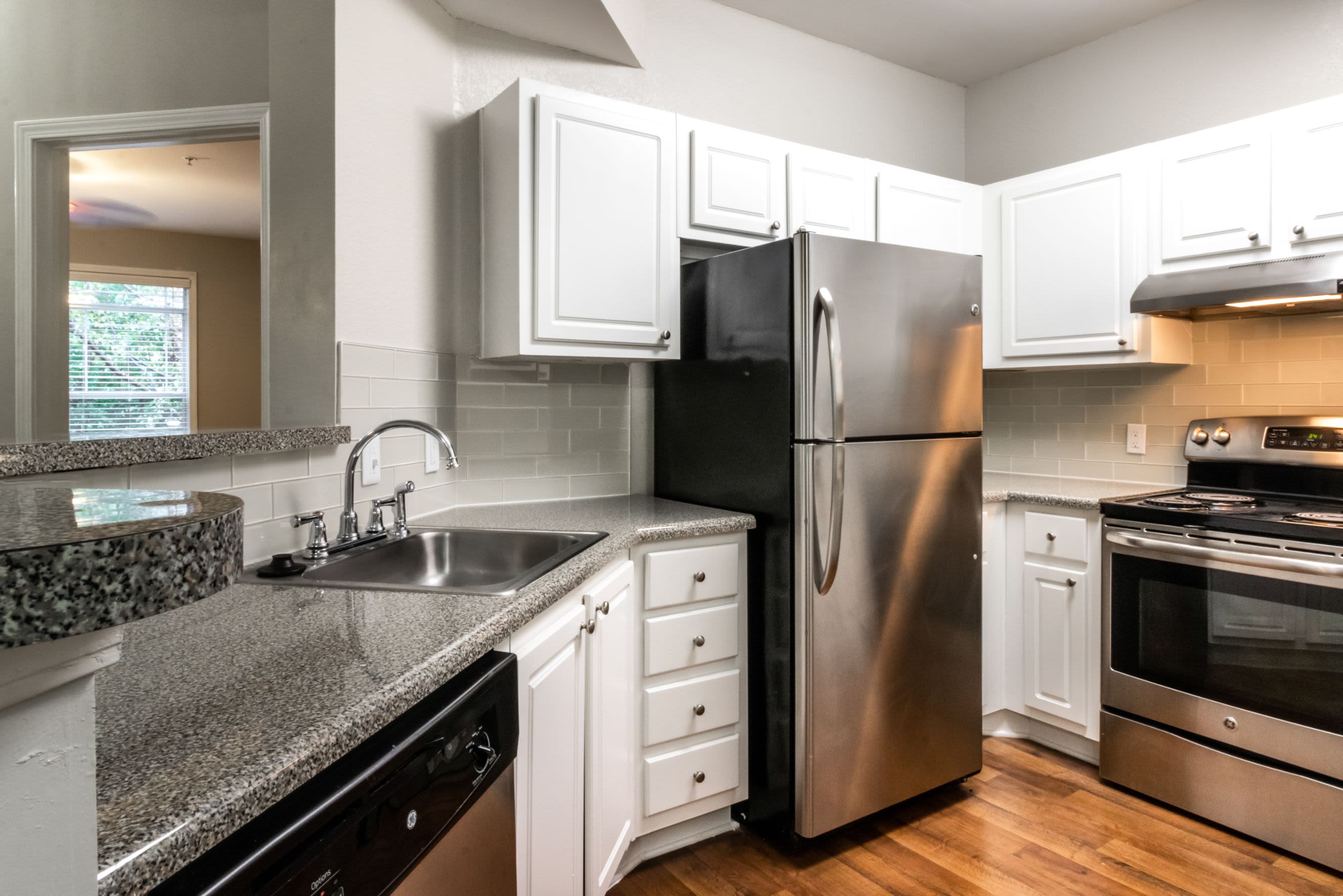 Modern kitchen with stainless steel appliances at Marquis Midtown West in Atlanta, Georgia