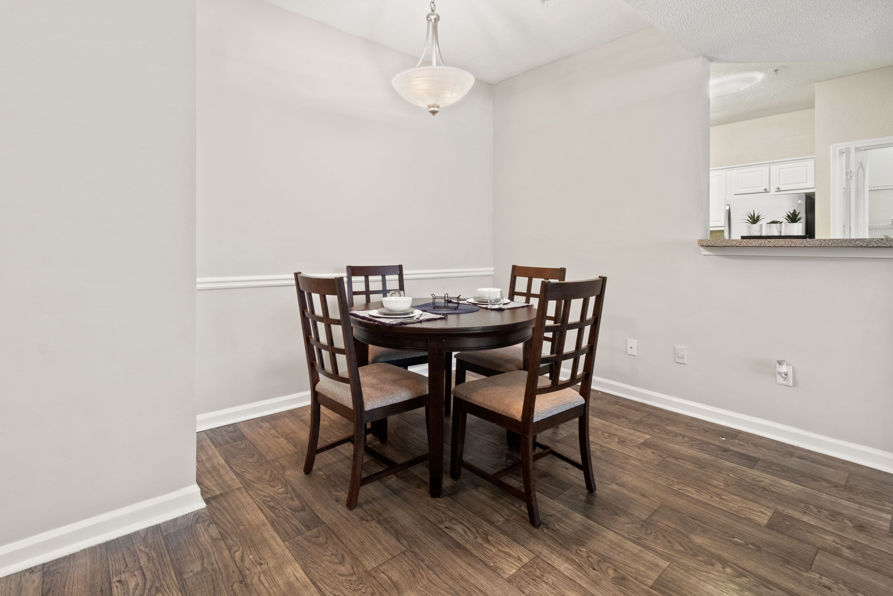 Bright dining room with wood floors at Marquis Midtown West in Atlanta, Georgia