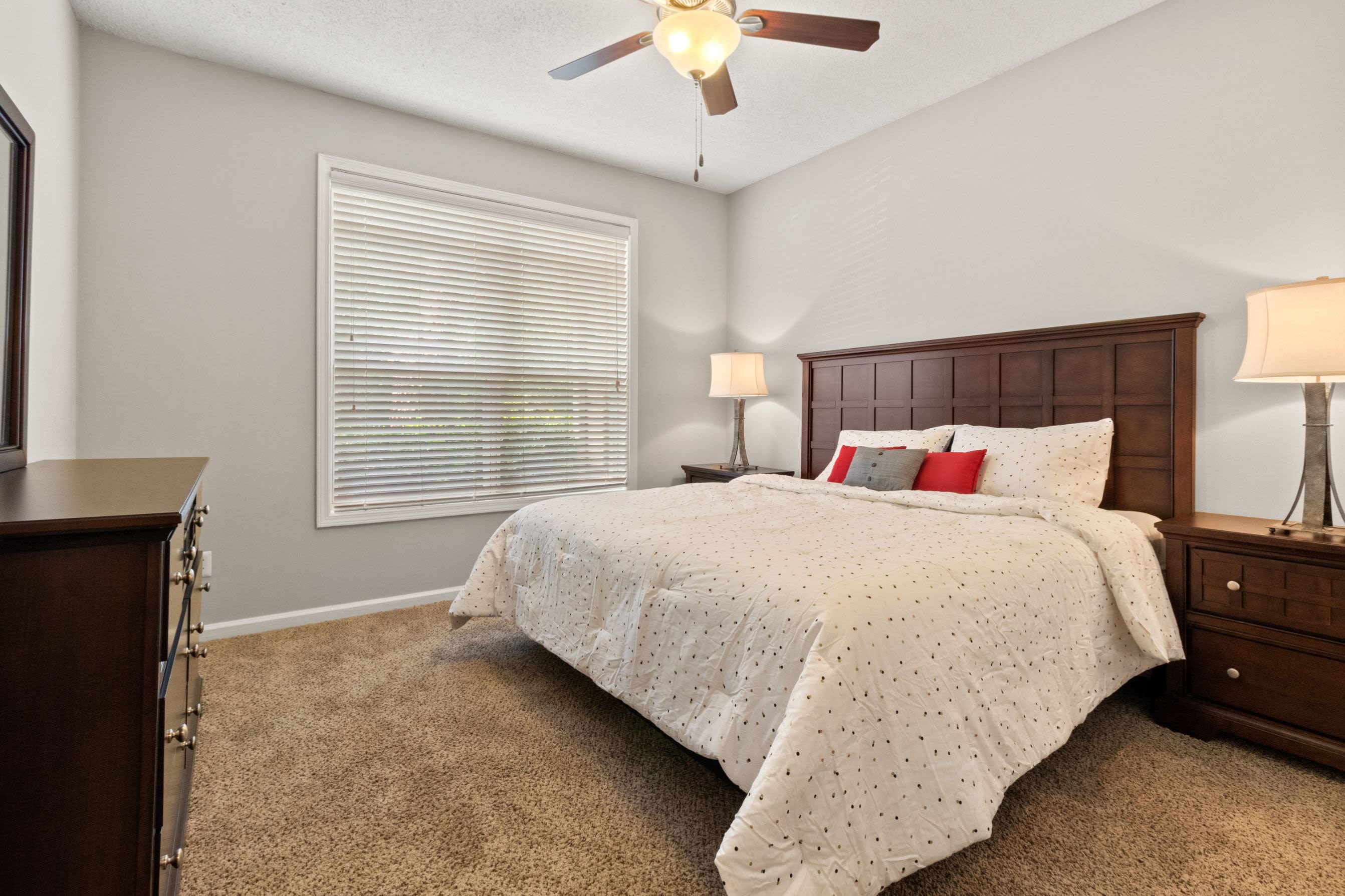 Bedroom with a ceiling fan at Marquis Midtown West in Atlanta, Georgia