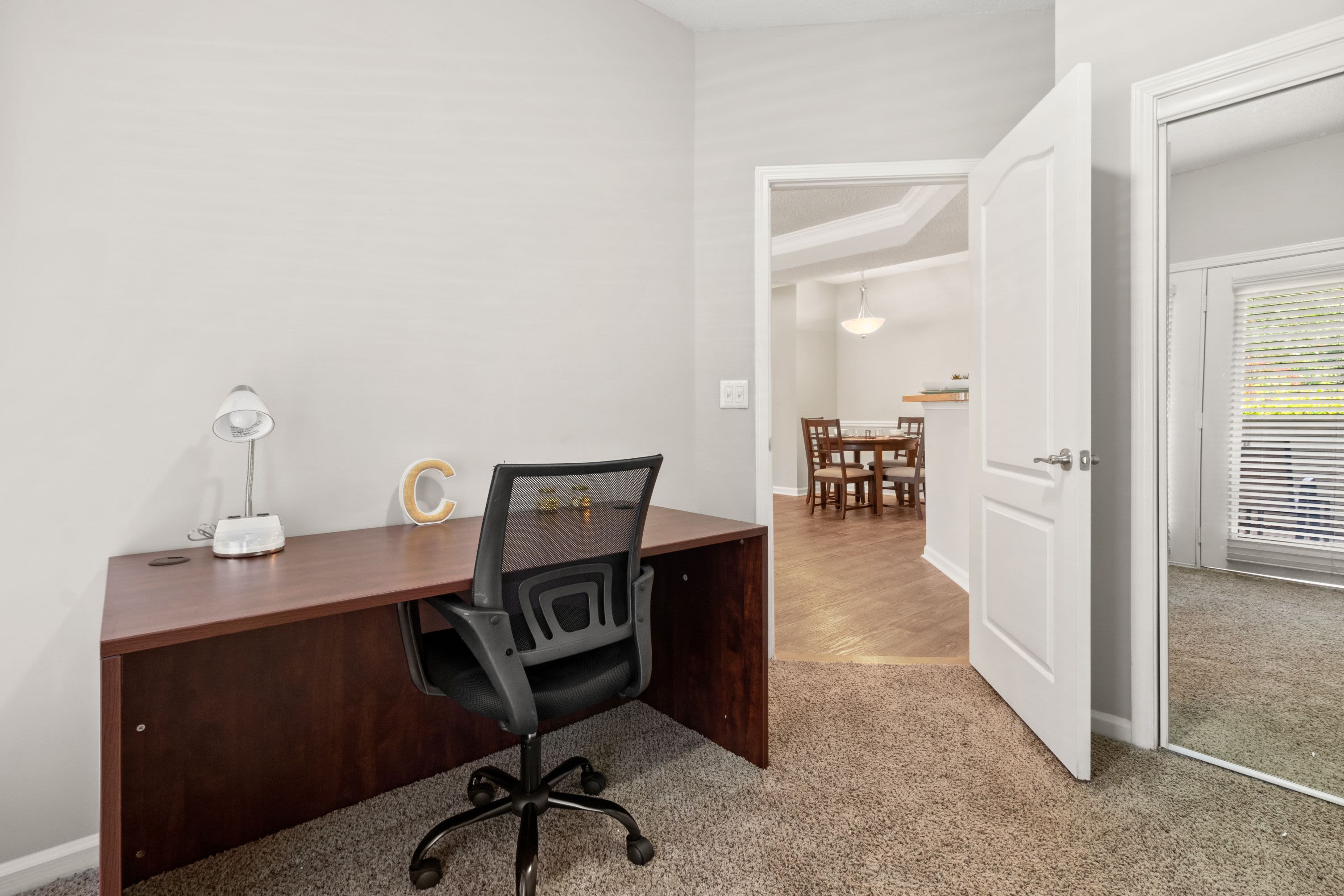 Private workspace with desk and office chair at Marquis Midtown West in Atlanta, Georgia