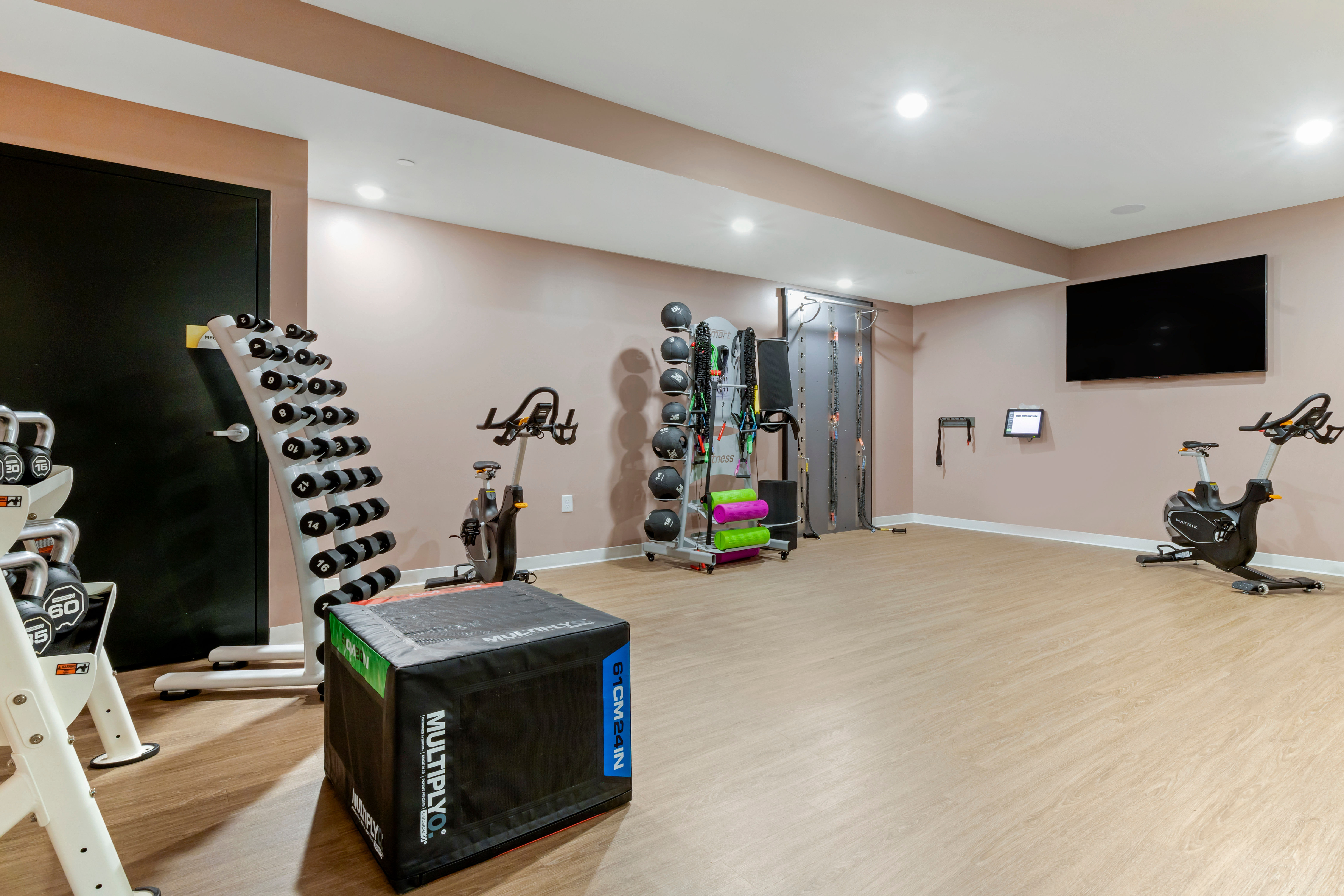 Residents checking out the fitness center at UNCOMMON Raleigh in Raleigh, North Carolina