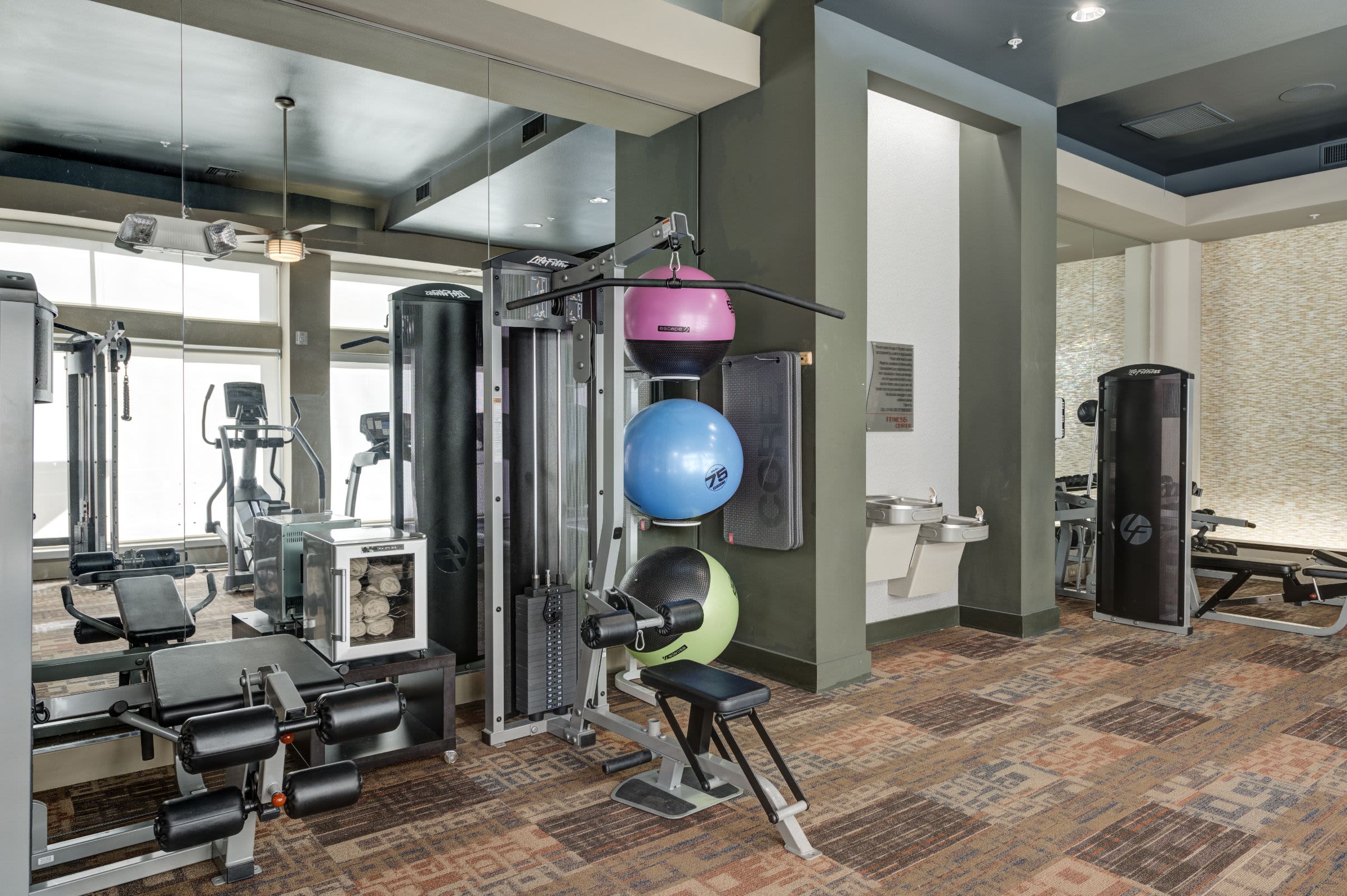 Weight machines and yoga balls in fitness center at The Marq at Ridgegate in Lone Tree, Colorado