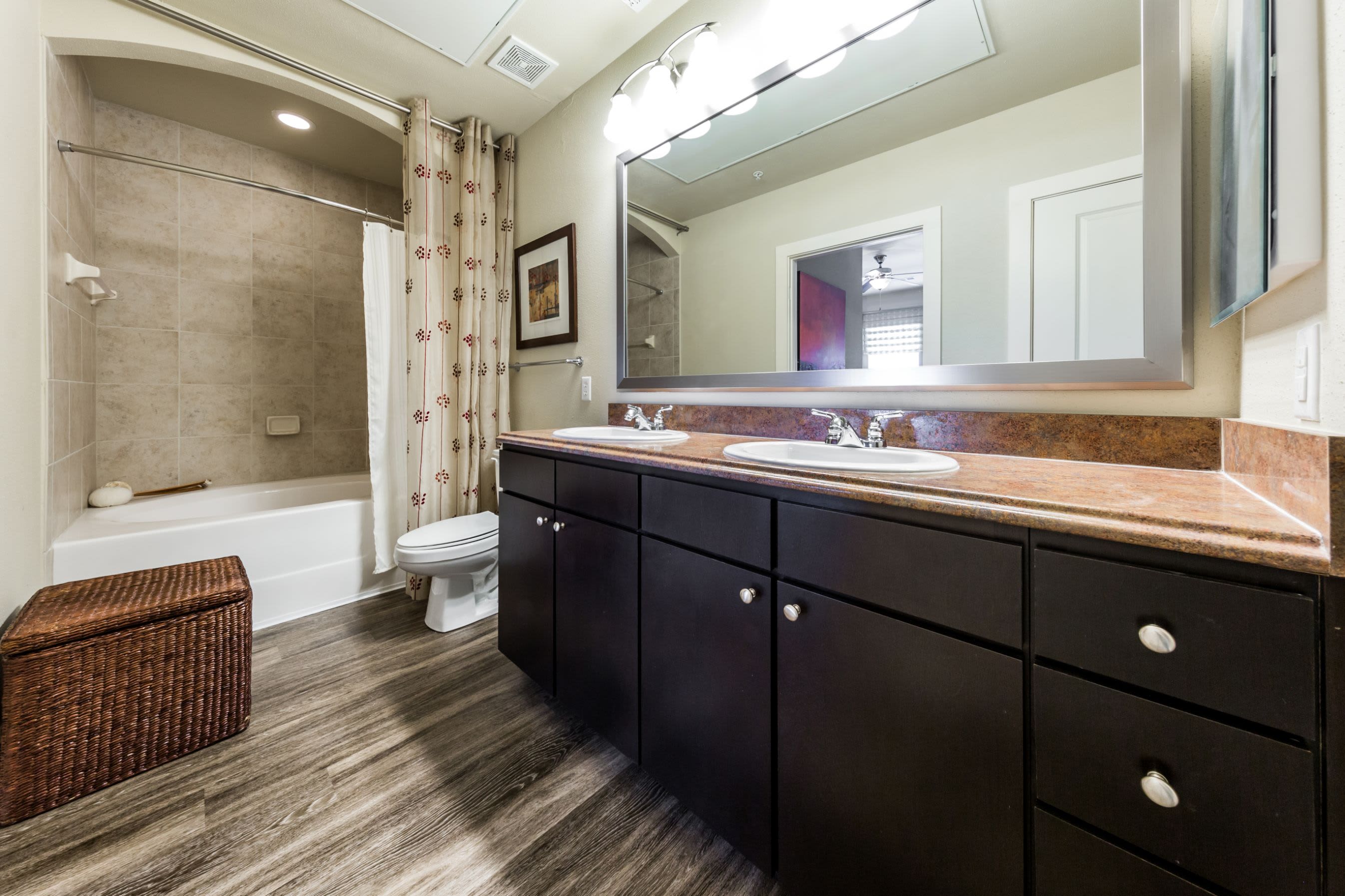 Clean bathroom with double sinks at The Marq at Ridgegate in Lone Tree, Colorado