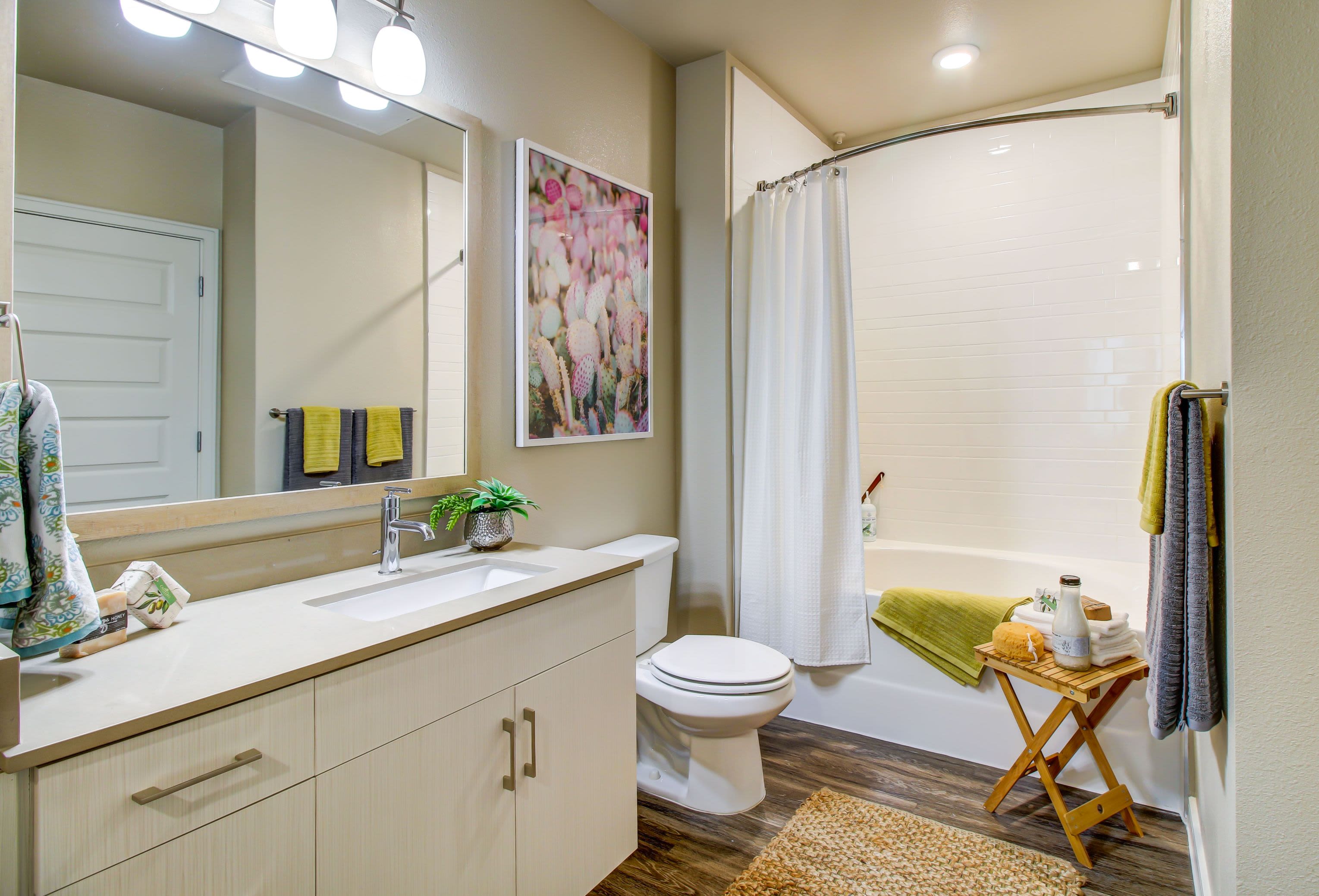 Bright bathroom with white cabinets at Westerly 360 in Austin, Texas