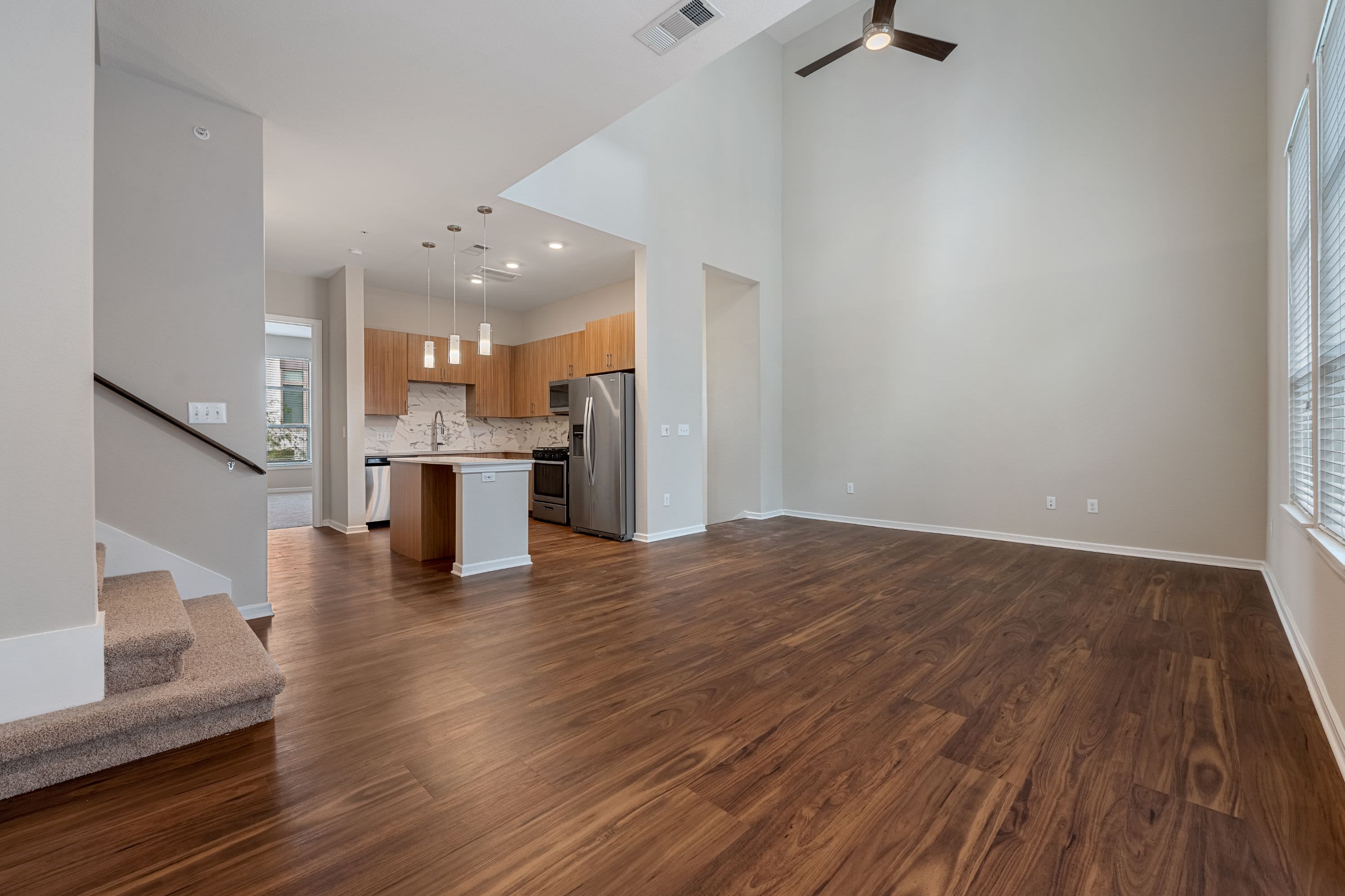Spacious living room with wood floors at Westerly 360 in Austin, Texas