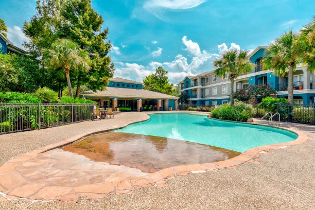 A view of the sparkling blue pool at Timberlakes at Atascocita in Humble, Texas