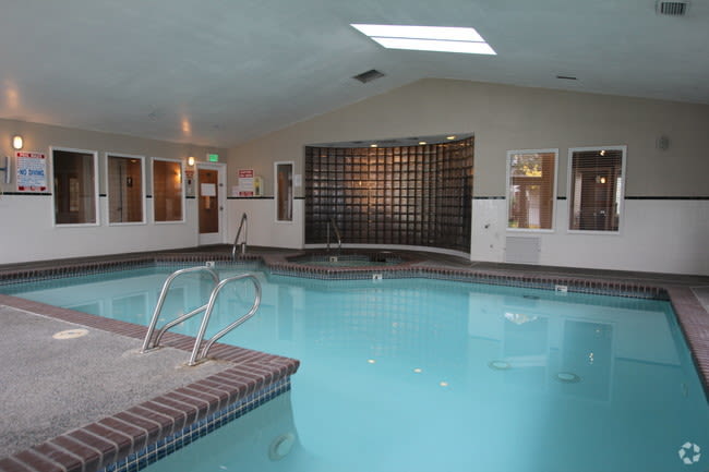 Indoor pool with a hot tub at Autumn Chase in Bothell, Washington