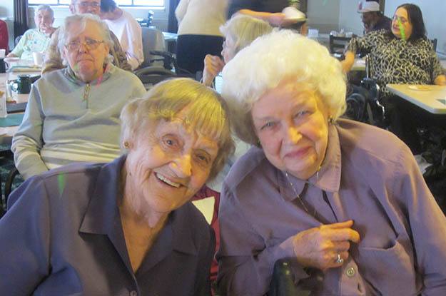 Two smiling residents at The Ridge at Madison in Fitchburg, Wisconsin