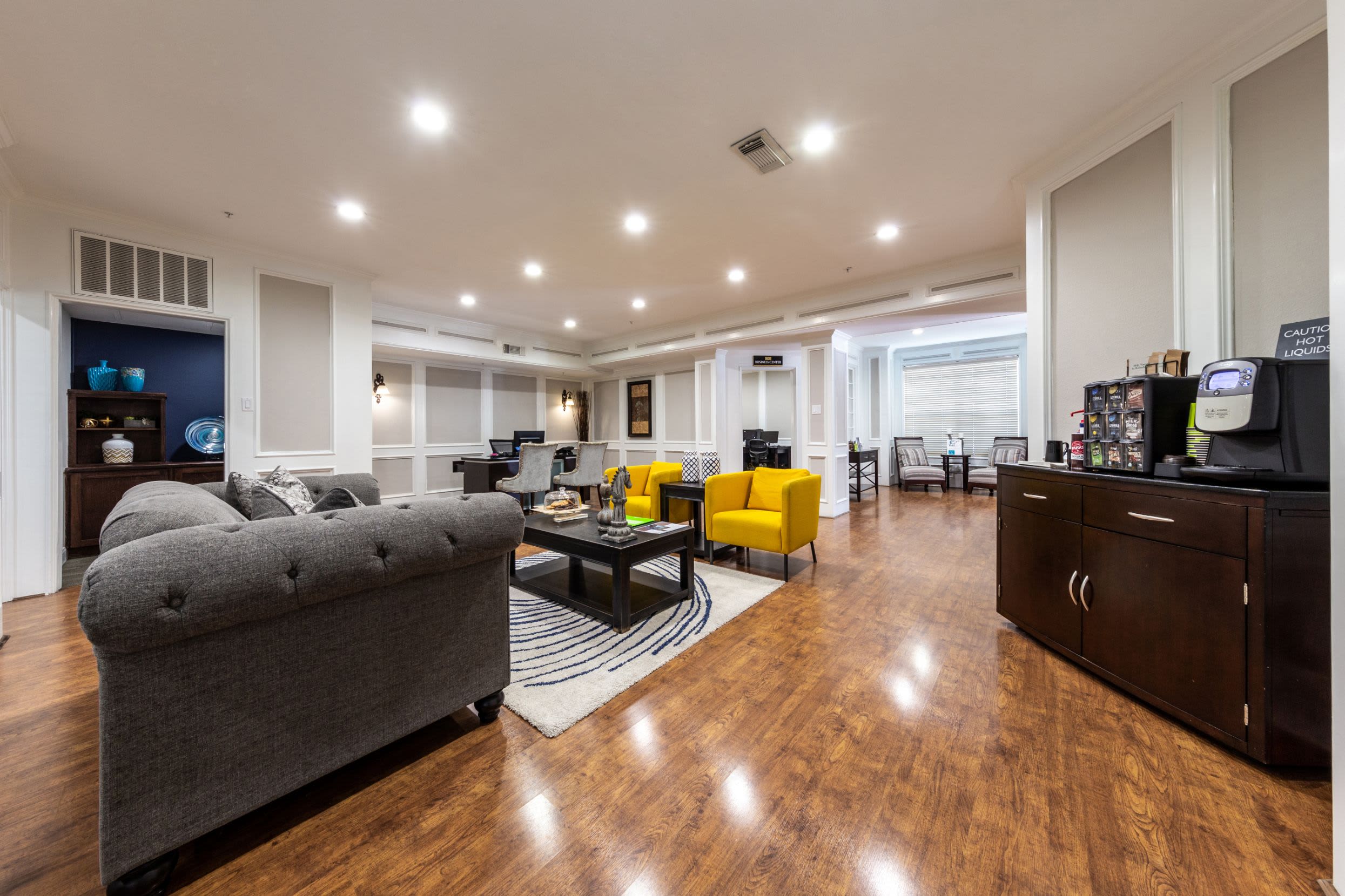 Community clubhouse with multiple couches at Marquis on Pin Oak in Houston, Texas