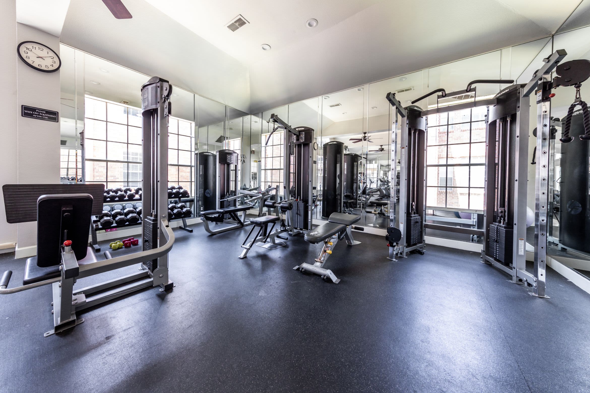 Free weights and cable machines in the fitness center at Marquis on Pin Oak in Houston, Texas