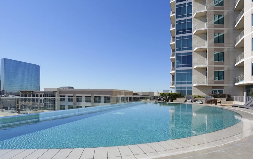 Resort-style swimming pool at The Heights at Park Lane in Dallas, Texas
