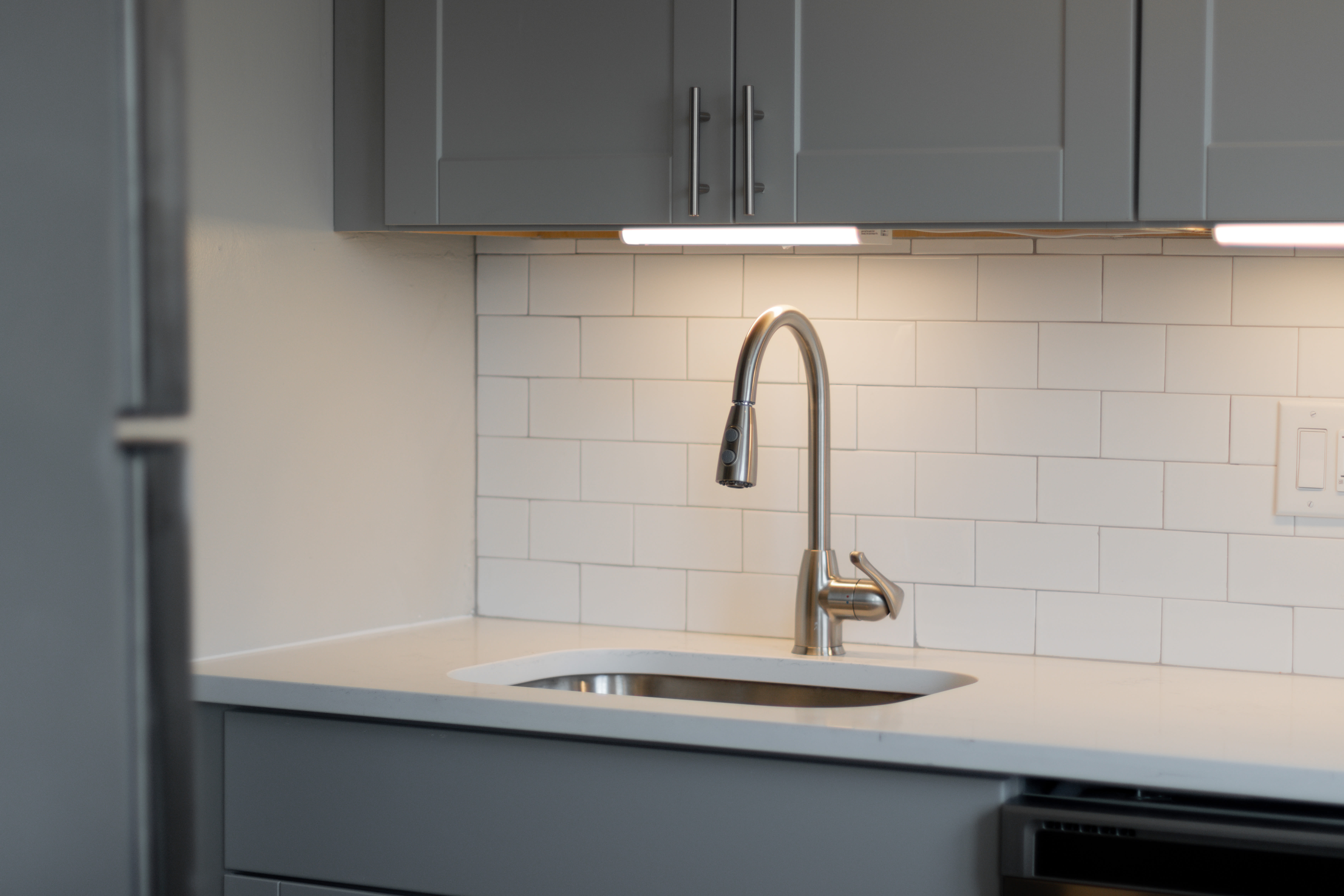 sink with lighting at Regency Pointe in Forestville, Maryland