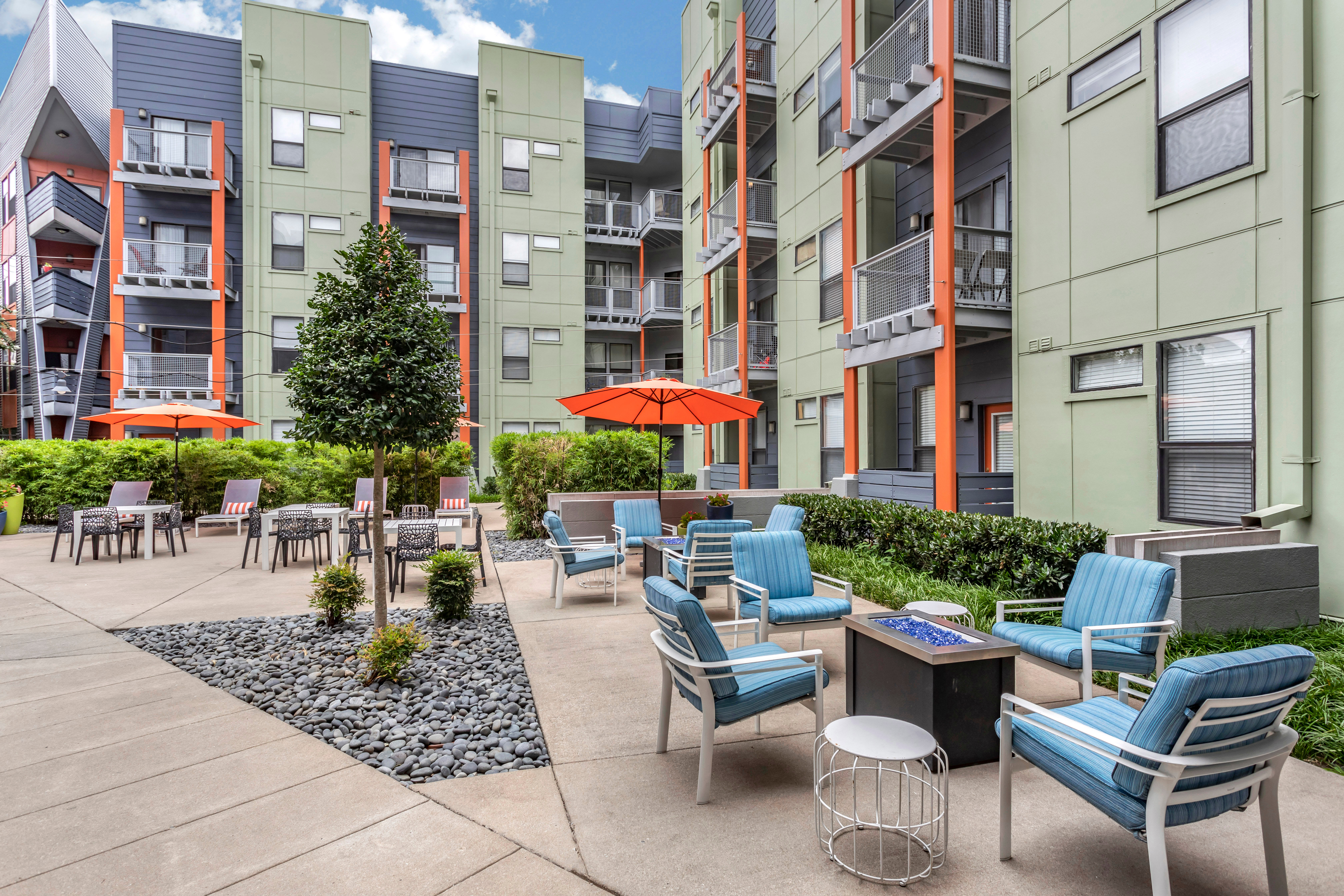 Outdoor fire pits and comfortable seating area at Olympus Midtown in Nashville, Tennessee