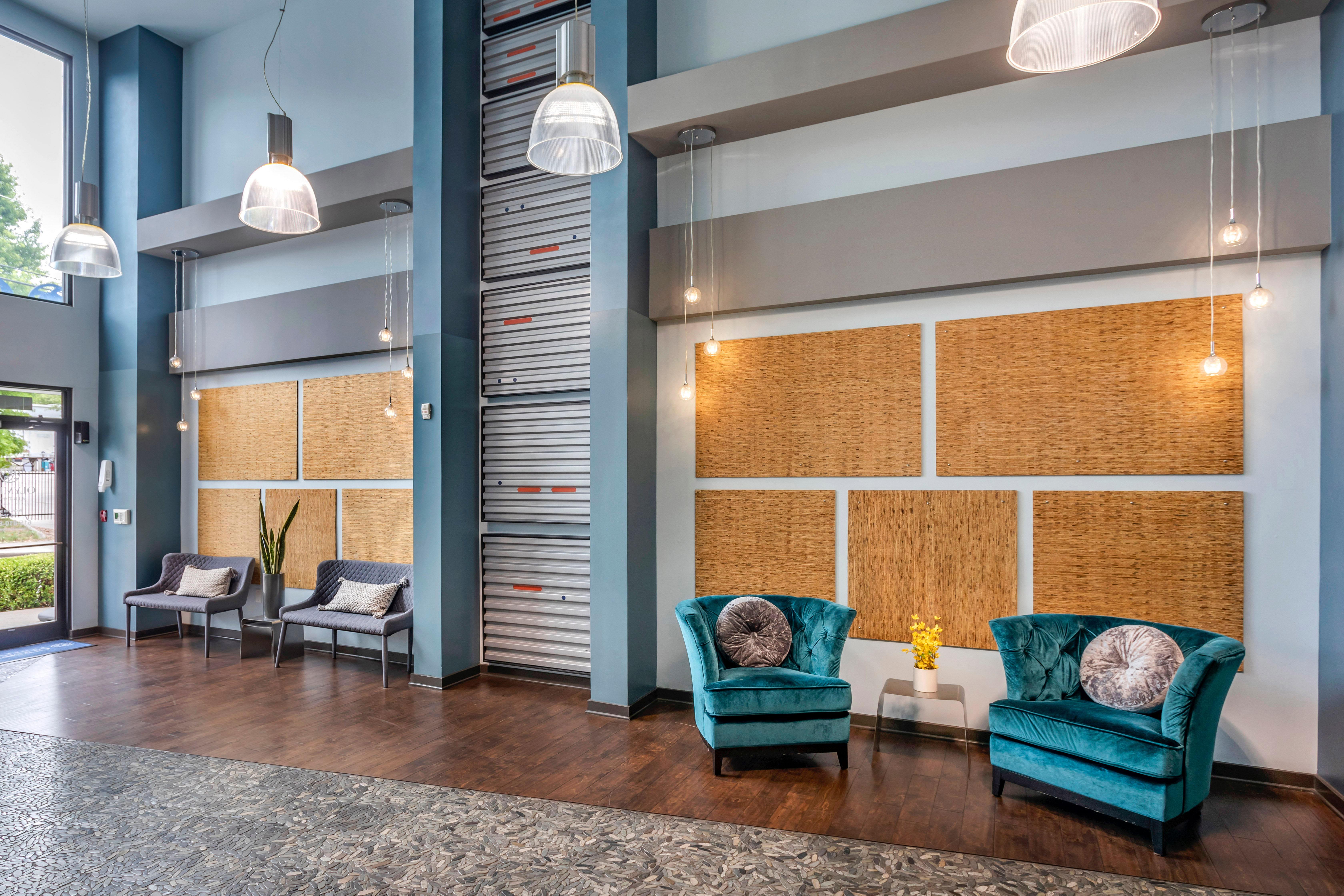 Welcoming lobby interior with comfortable places to relax at Olympus Midtown in Nashville, Tennessee