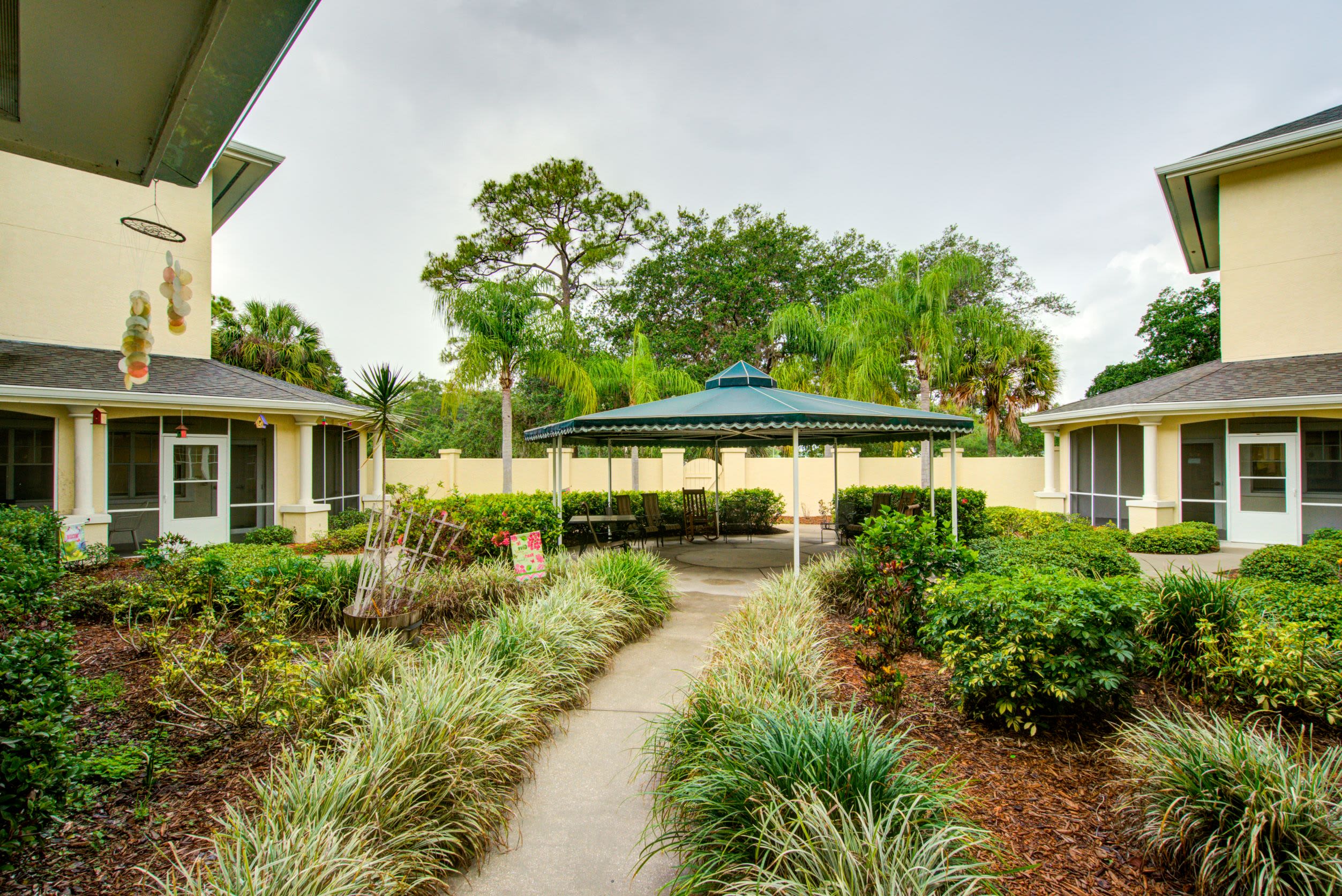 gardened walking path at Truewood by Merrill, Charlotte Center in Port Charlotte, Florida.