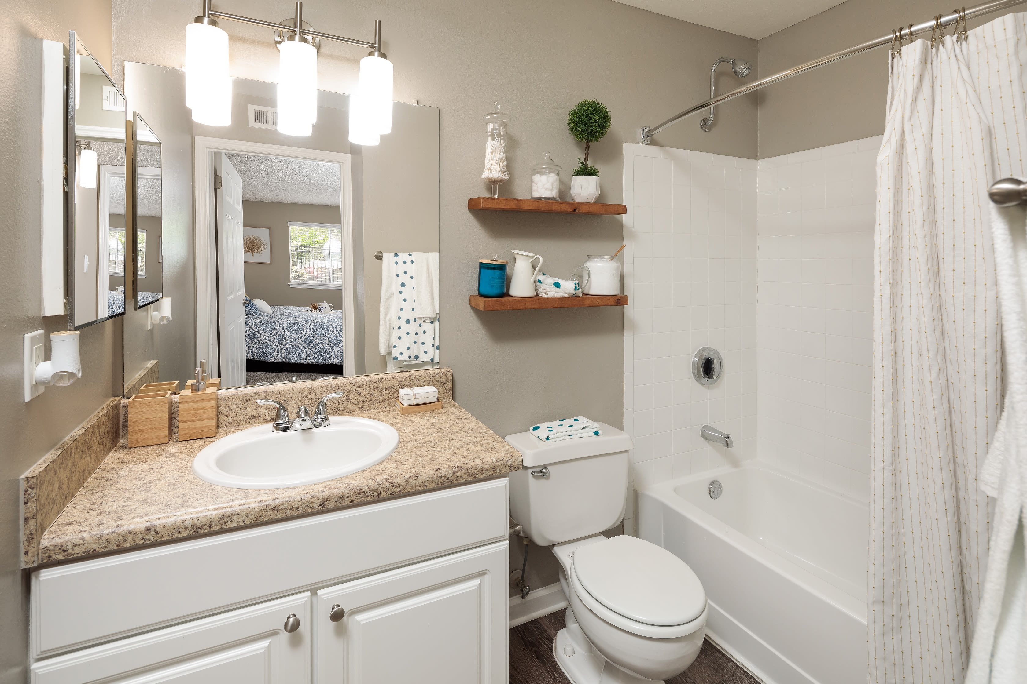 A well decorated bathroom in an apartment at 1801 MetroWest in Orlando, Florida