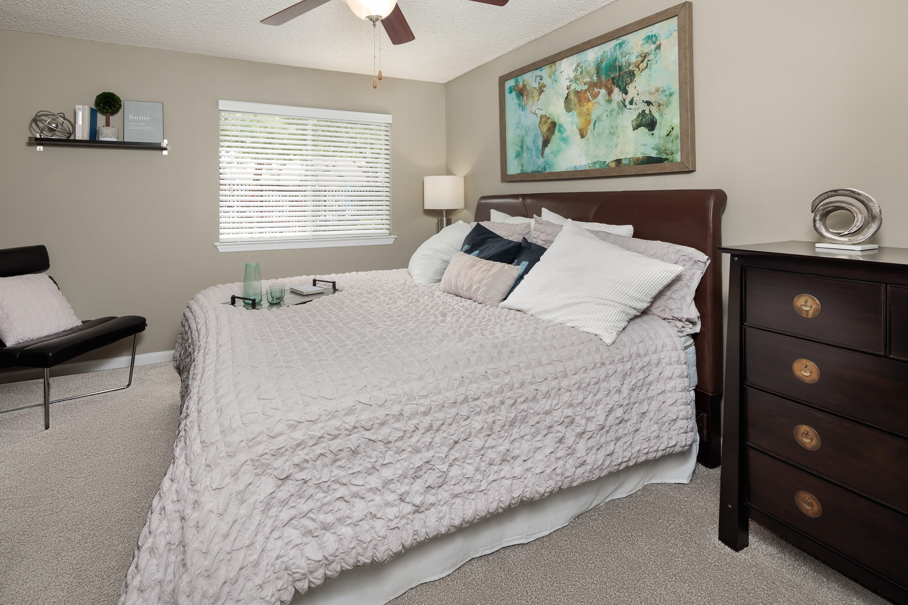 A furnished bedroom in an apartment at 1801 MetroWest in Orlando, Florida