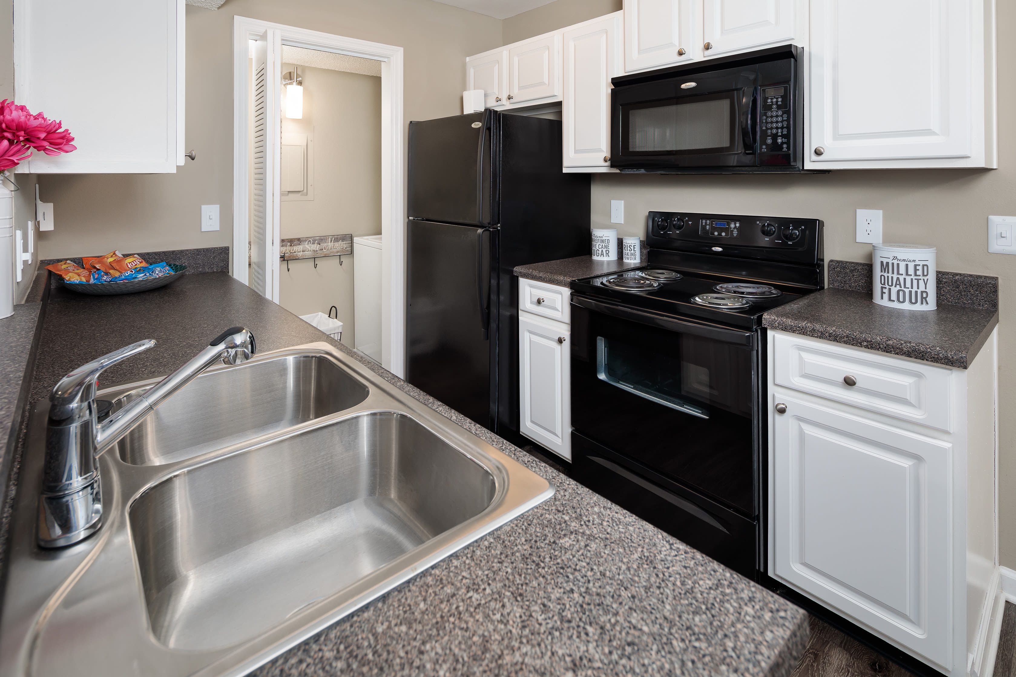 An updated kitchen in an apartment at 1801 MetroWest in Orlando, Florida