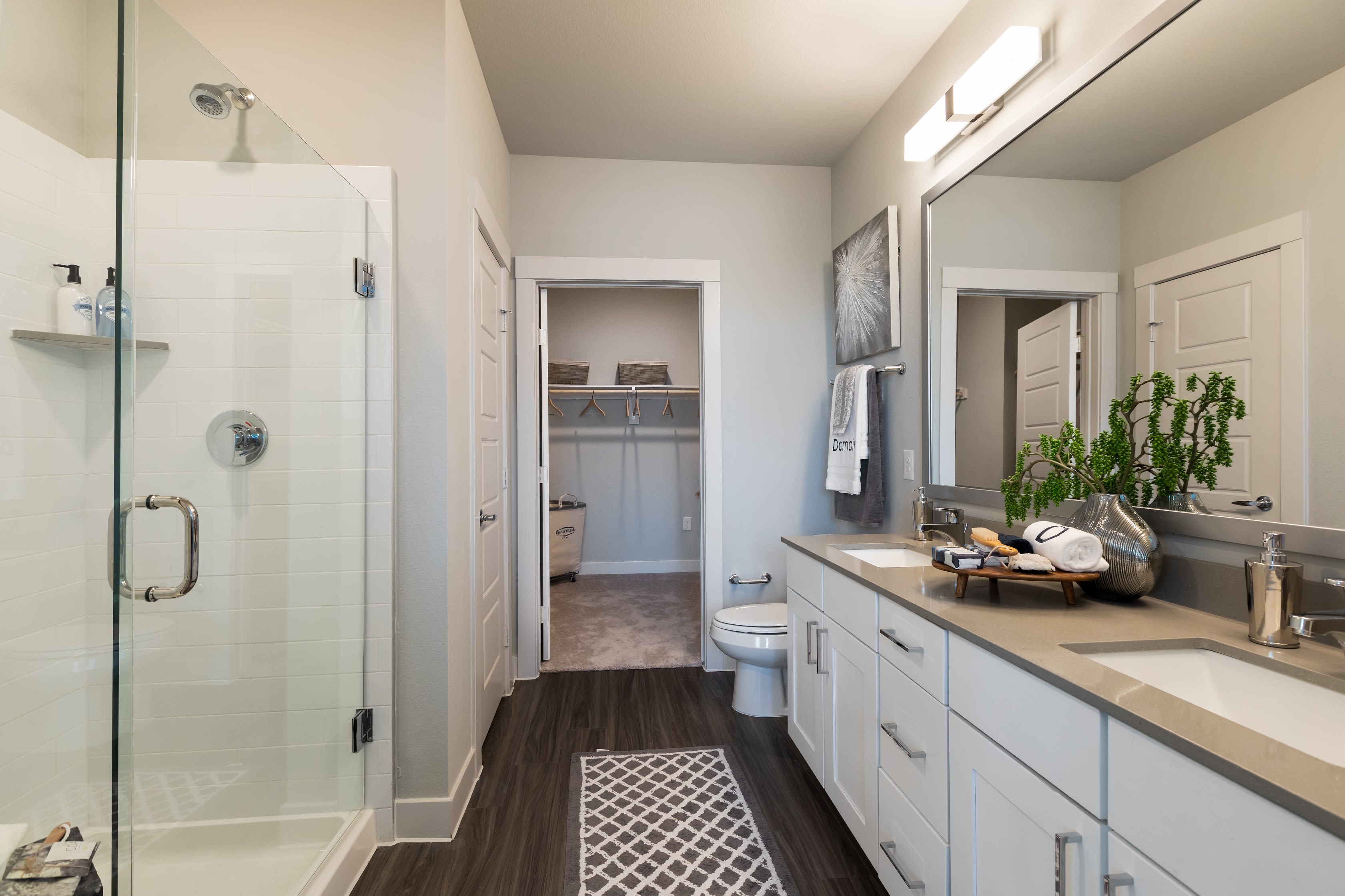 Roomy bathroom with lots of storage space under the large vanity at Domain at Founders Parc in Euless, Texas