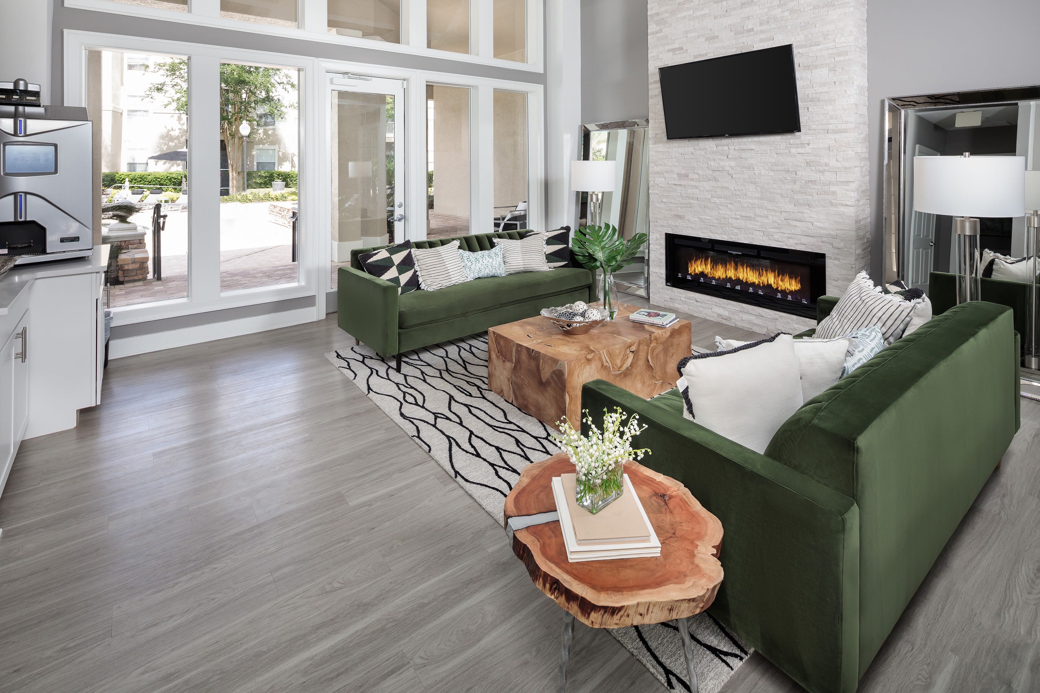 Well-decorated open-concept living space in a model home at Eddison at Deerwood Park in Jacksonville, Florida