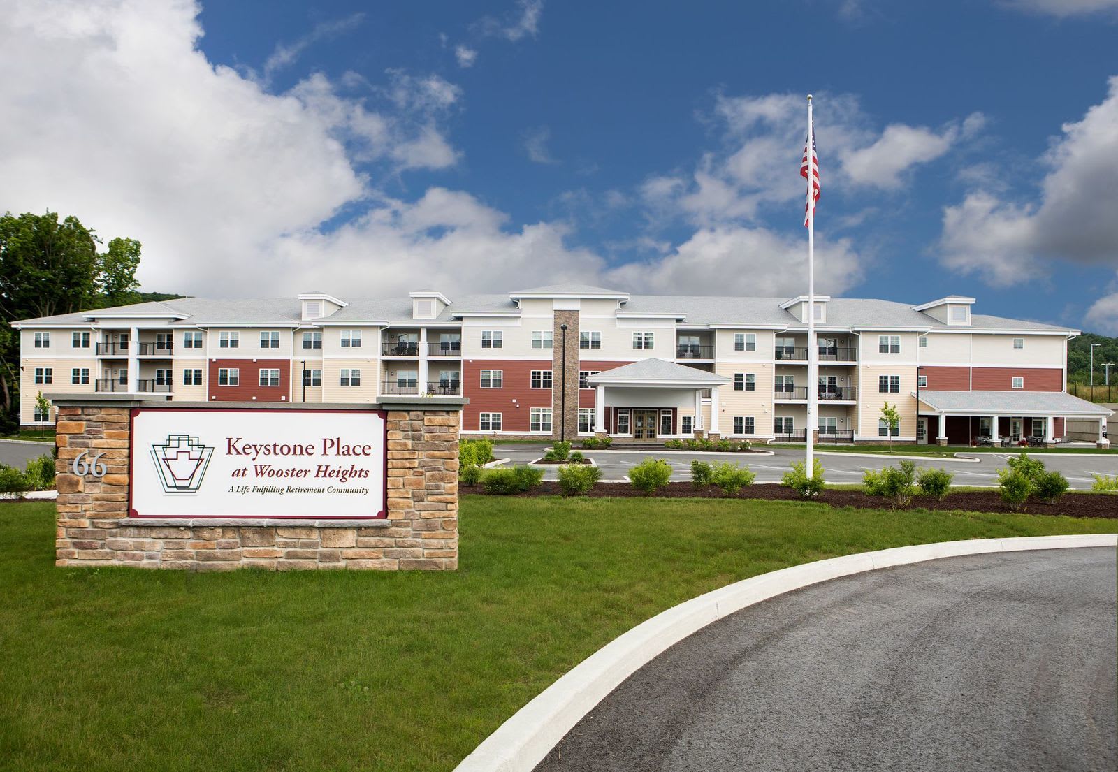 Lawn and grounds with walking paths at Keystone Place at Wooster Heights in Danbury, Connecticut