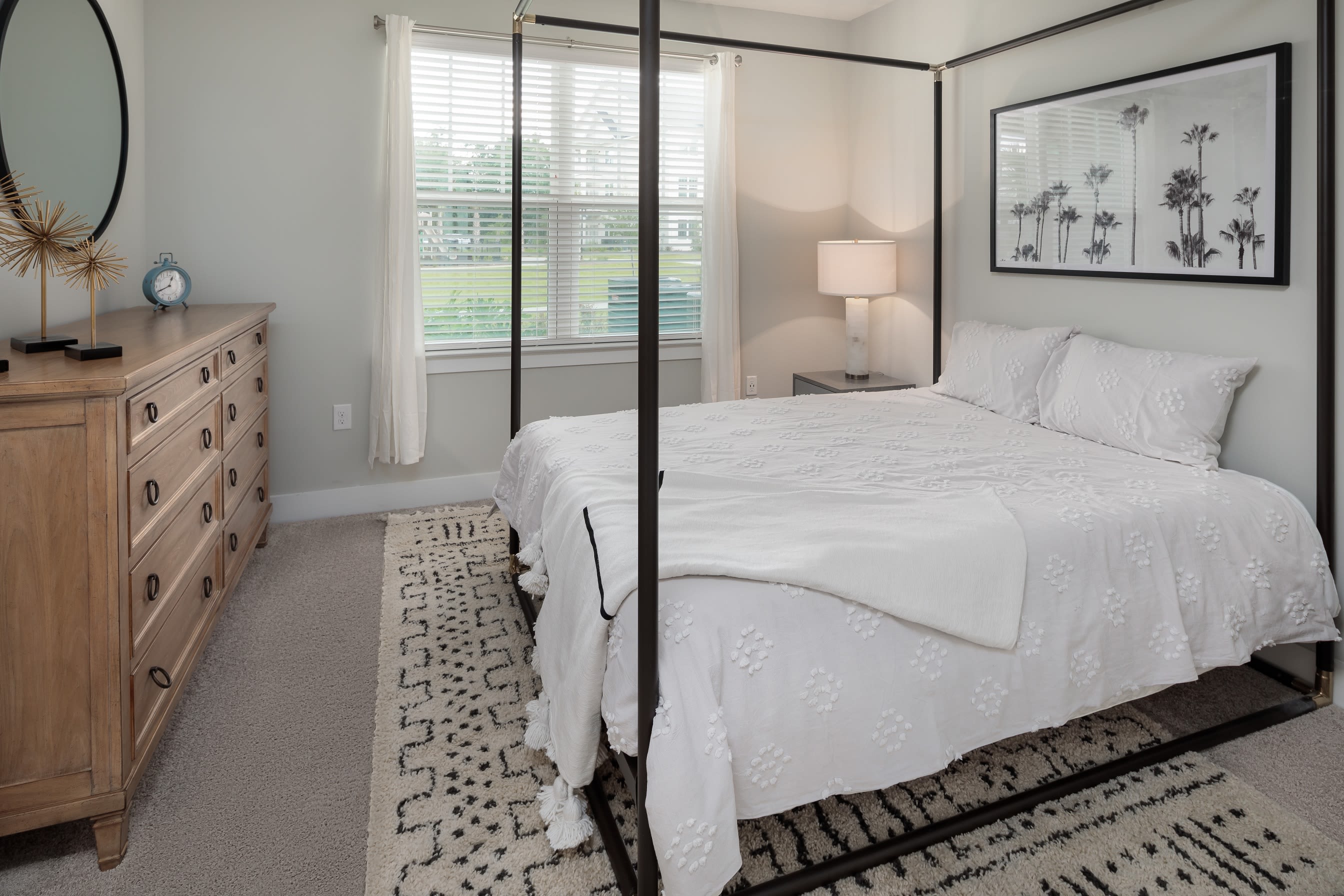 A furnished model bedroom at The Mason in Ladson, South Carolina