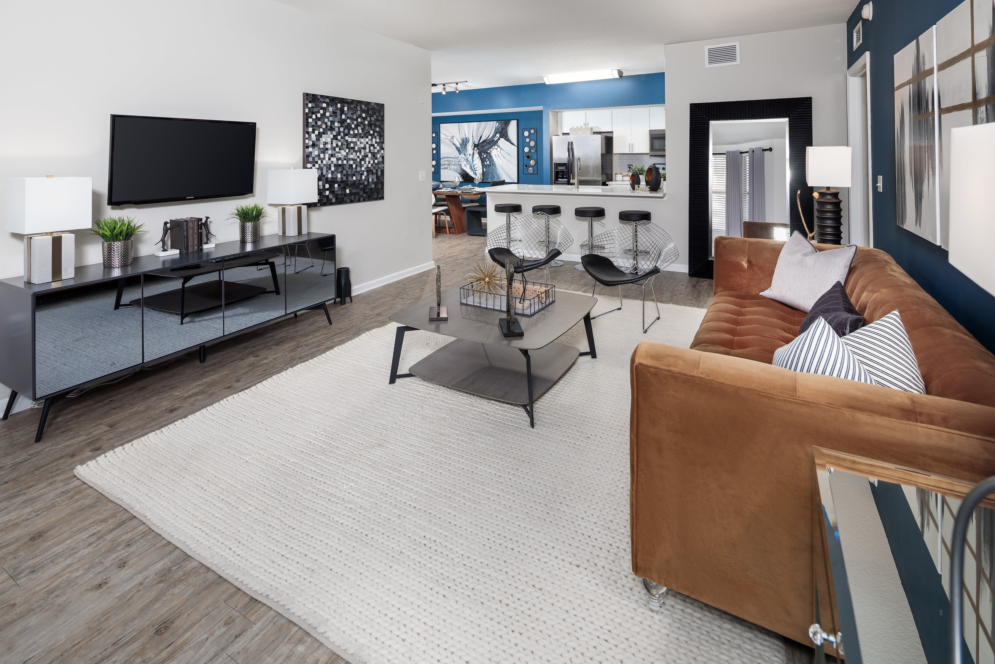 Spacious living area in decorated modern home with large windows for tons of light at The Pearl in Ft Lauderdale, Florida