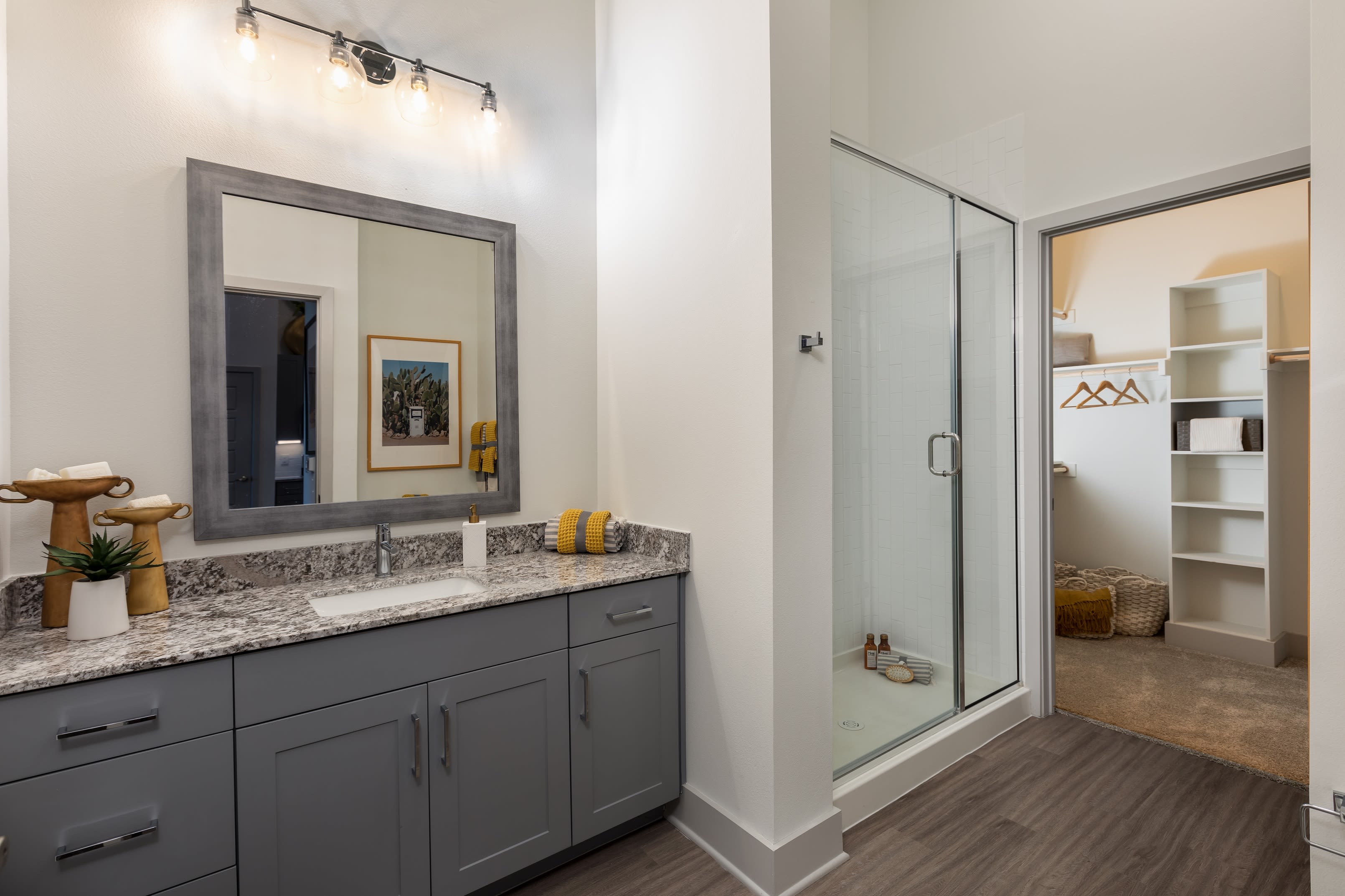 Roomy bathroom with lots of storage space under the large vanity at The ReVe in Garland, Texas