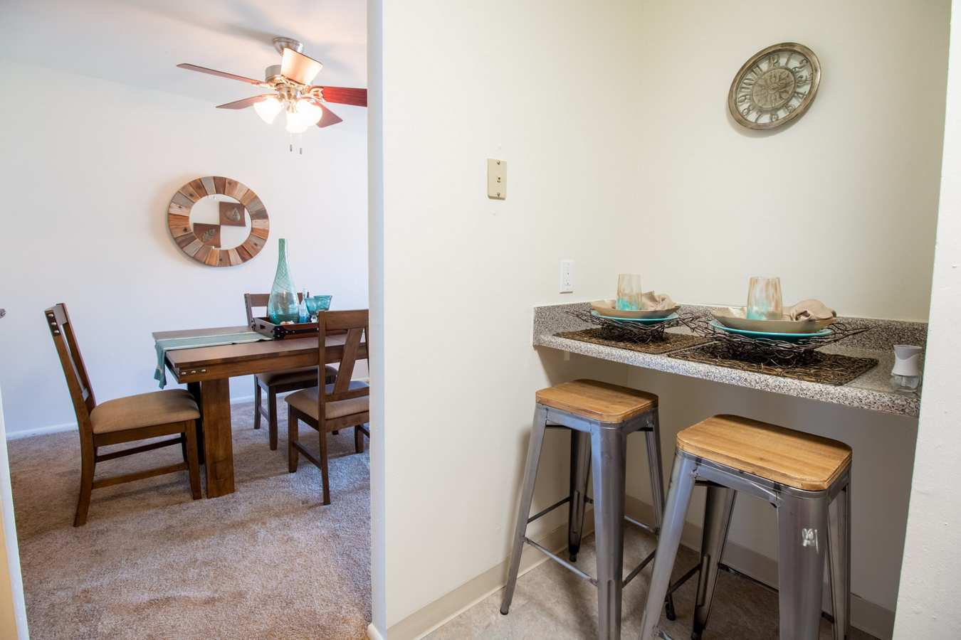 Model dining area with breakfast bar at Mill Village in Millville, New Jersey