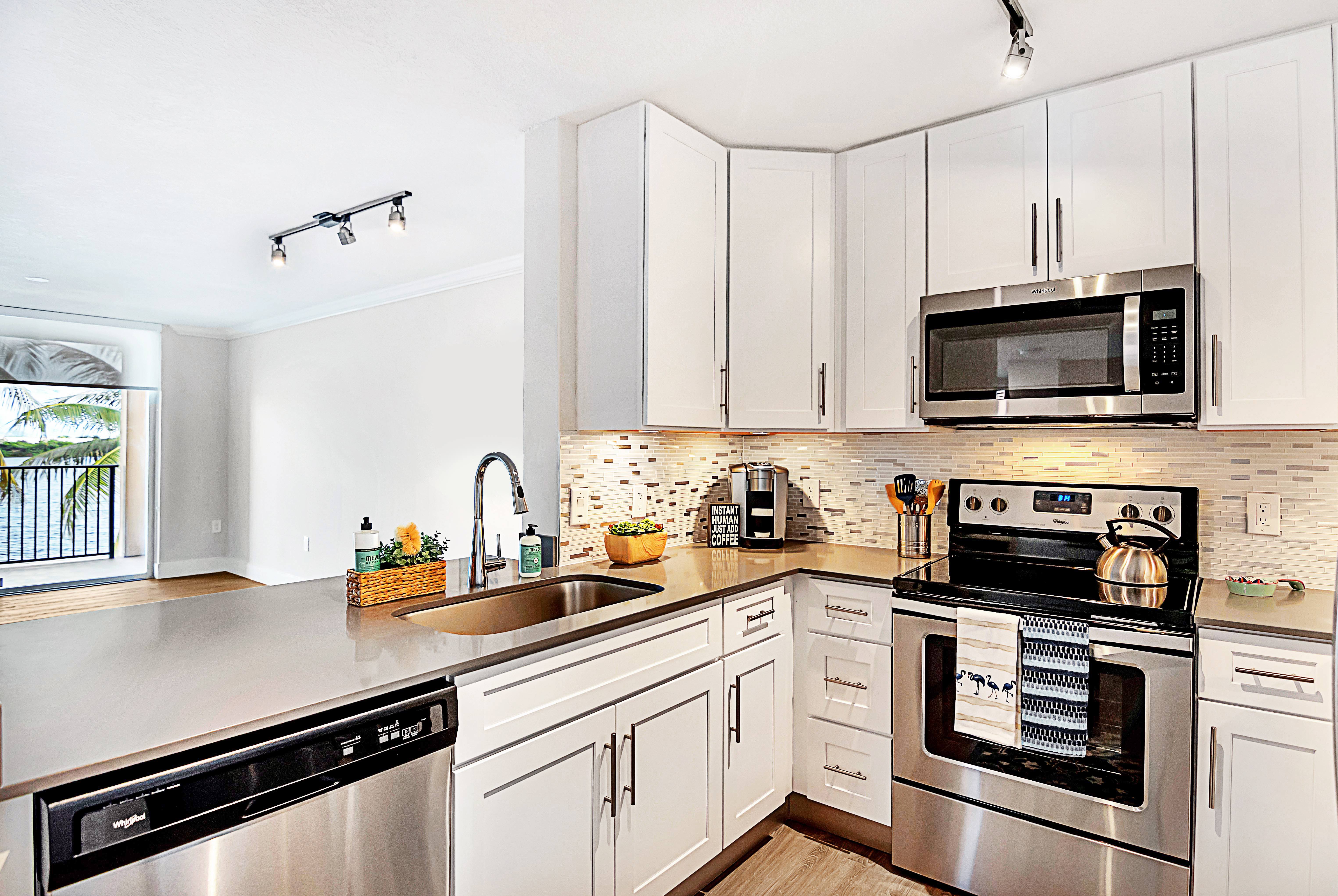 Stainless steel appliances and open kitchen at St. Tropez Apartments in Miami Lakes, Florida