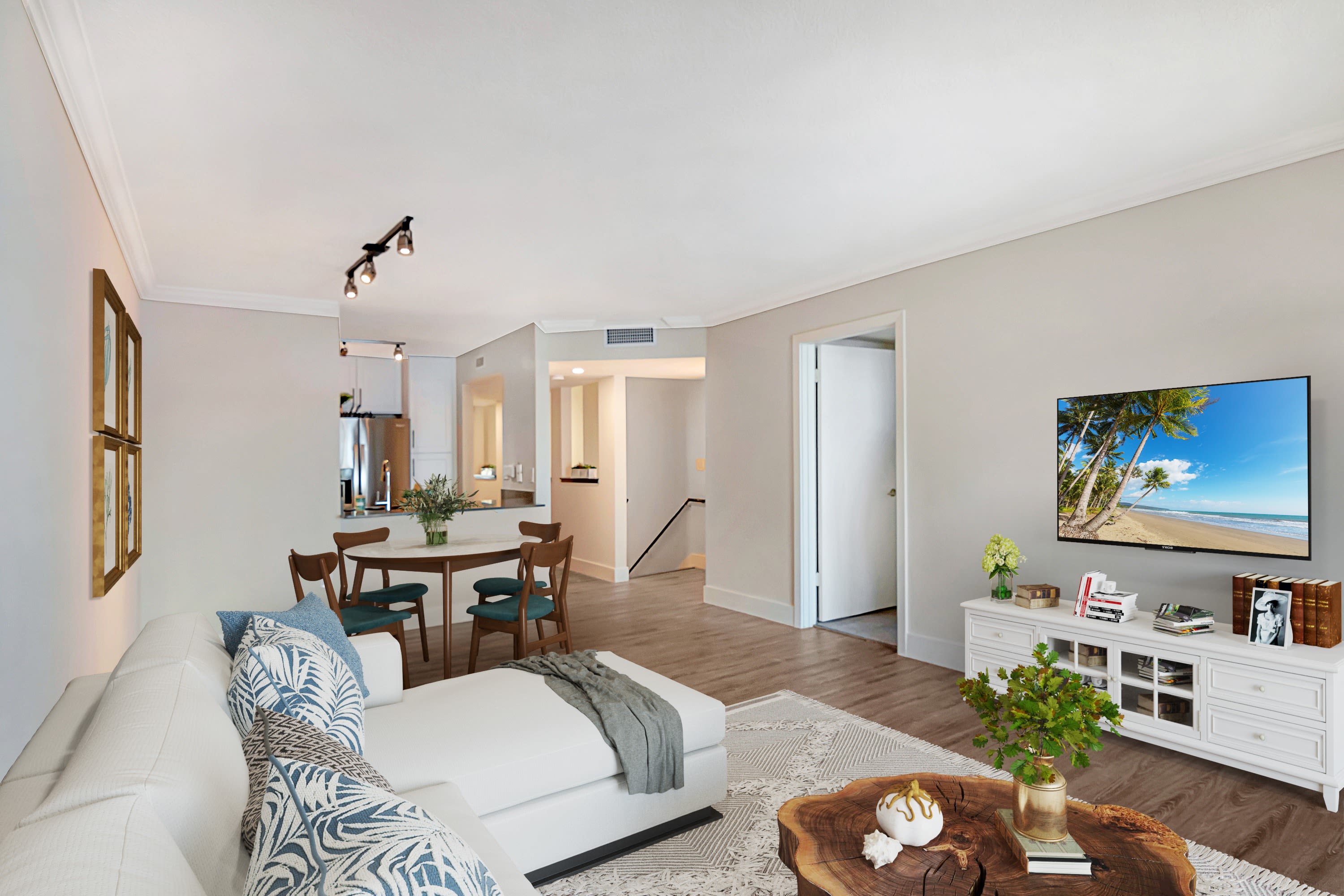 Open living room and dining room at St. Tropez Apartments in Miami Lakes, Florida