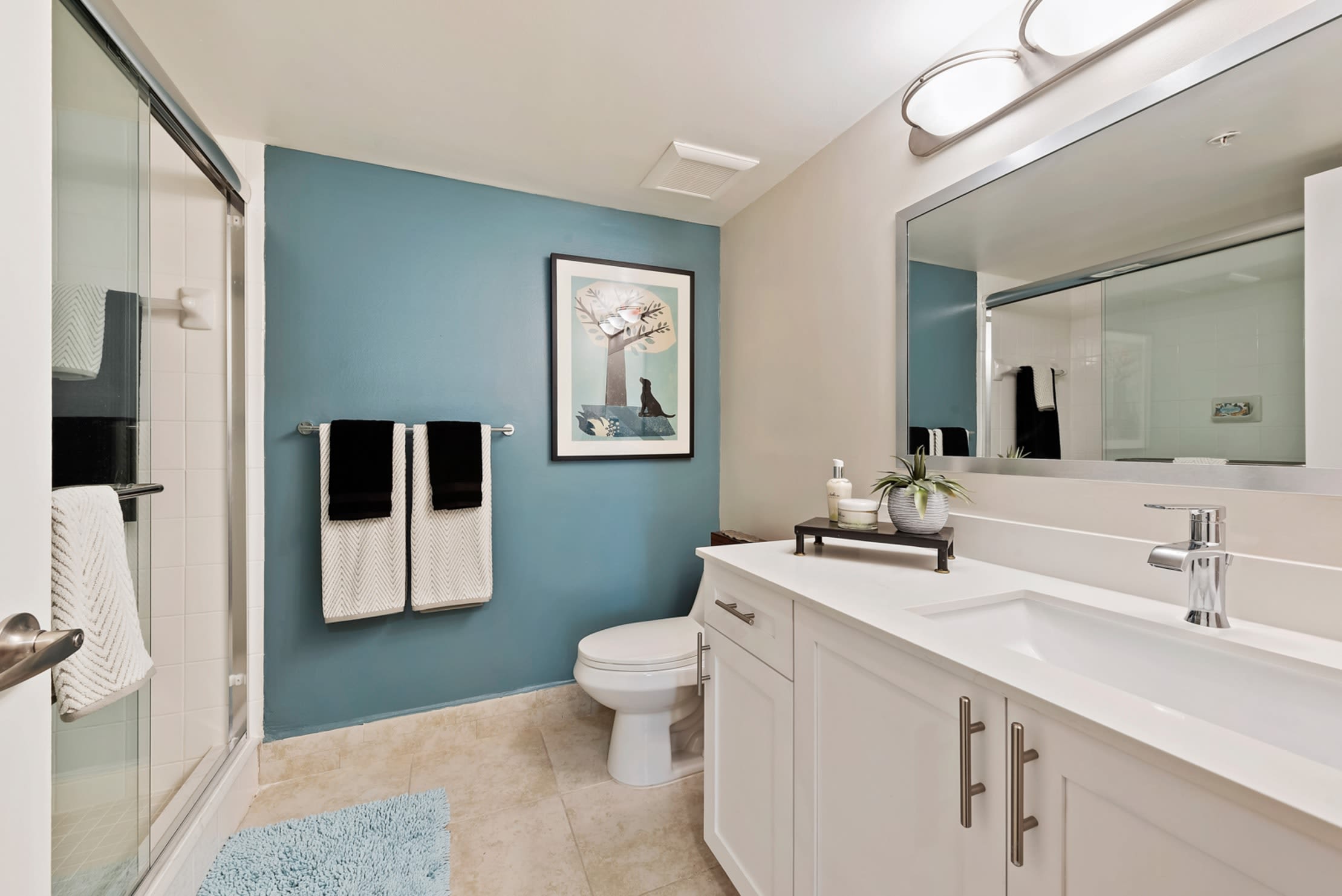 Beautiful model bathroom with large counter space at Crescent House Apartments in Miami Lakes, Florida