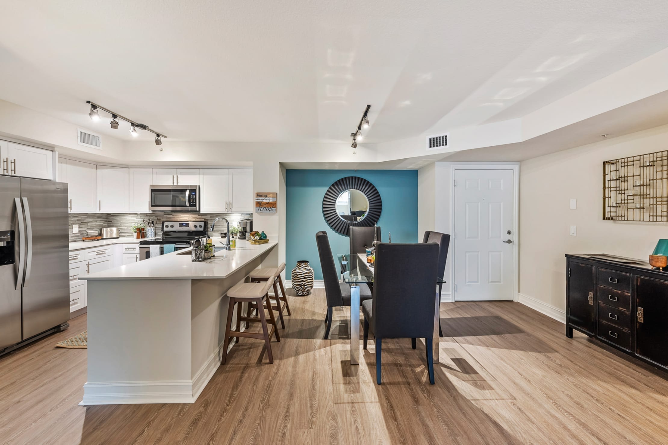 Spacious dining room and kitchen area at Crescent House Apartments in Miami Lakes, Florida
