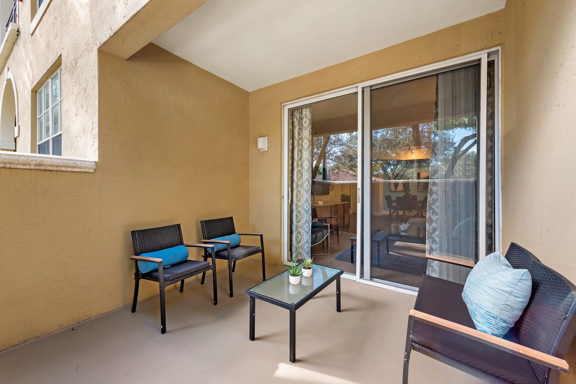 Private outdoor patio space at Fountain House Apartments in Miami Lakes, Florida