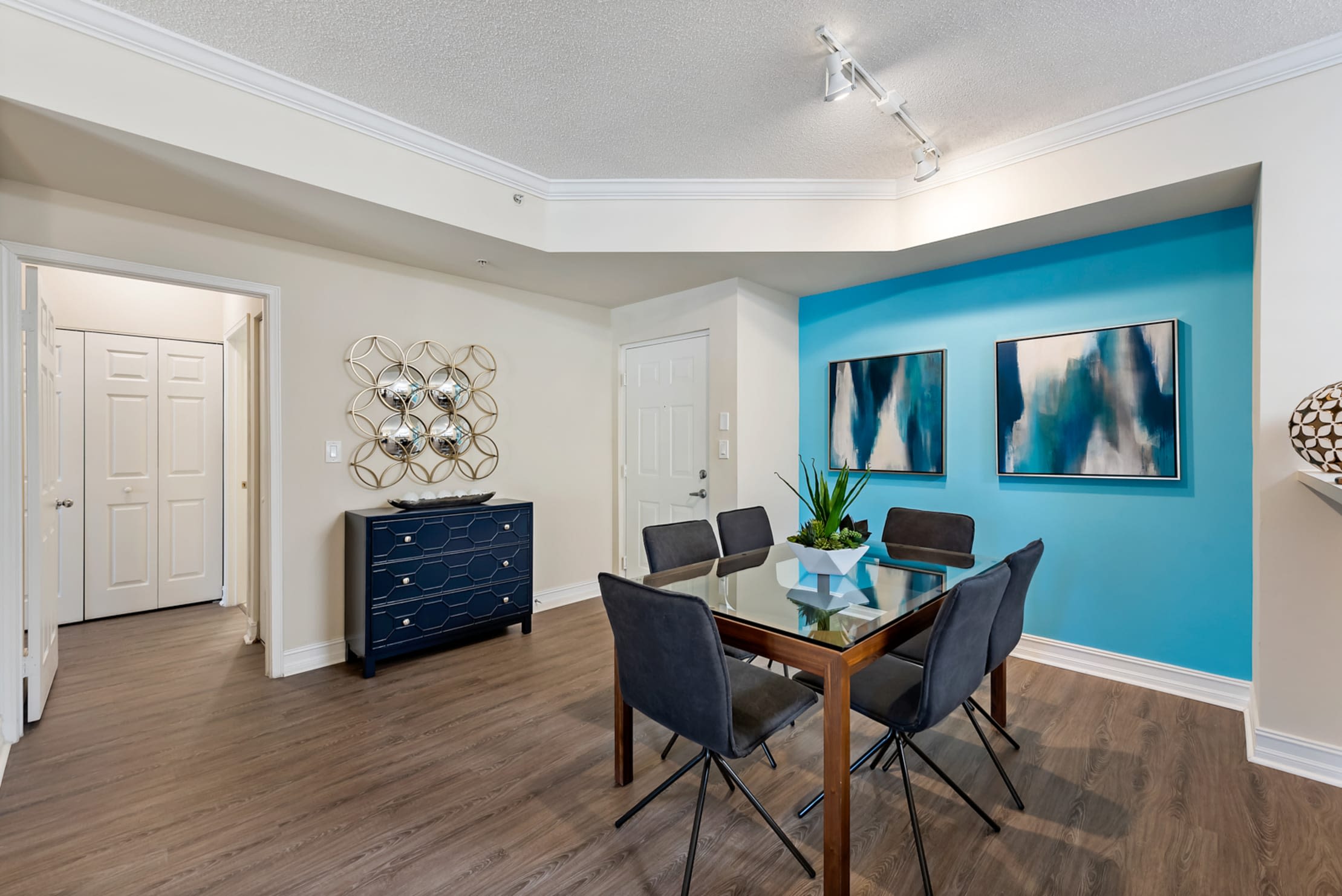 Spacious dining room with hardwood floors at Fountain House Apartments in Miami Lakes, Florida