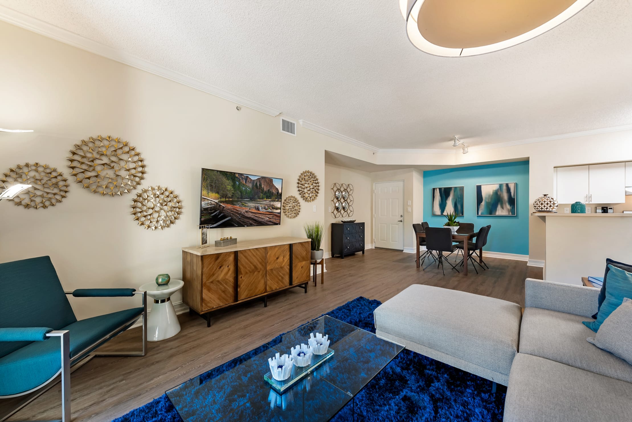 Open space living room with hardwood floors at Fountain House Apartments in Miami Lakes, Florida