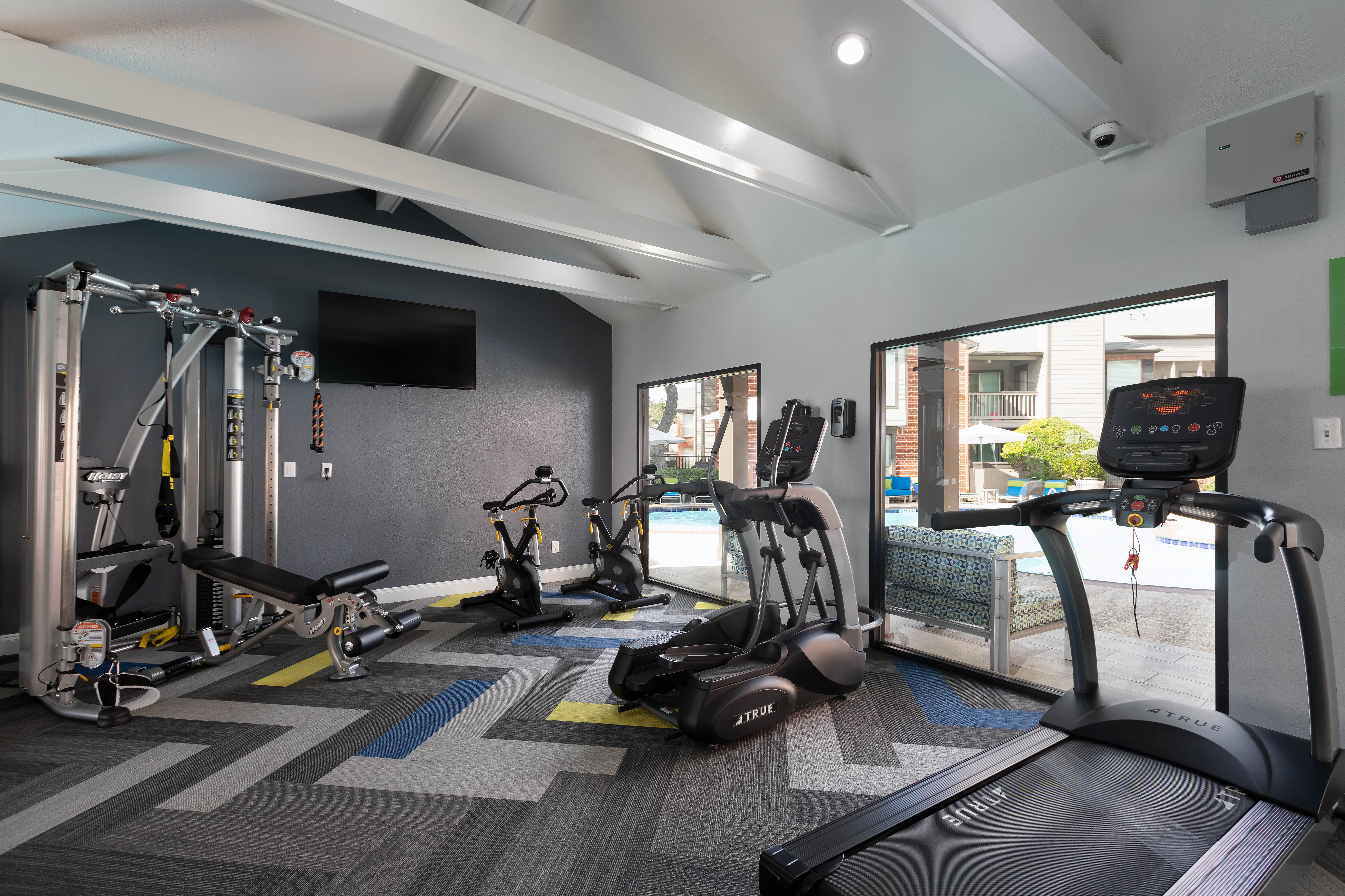Gym with individual workout stations at Finley West in Houston, Texas