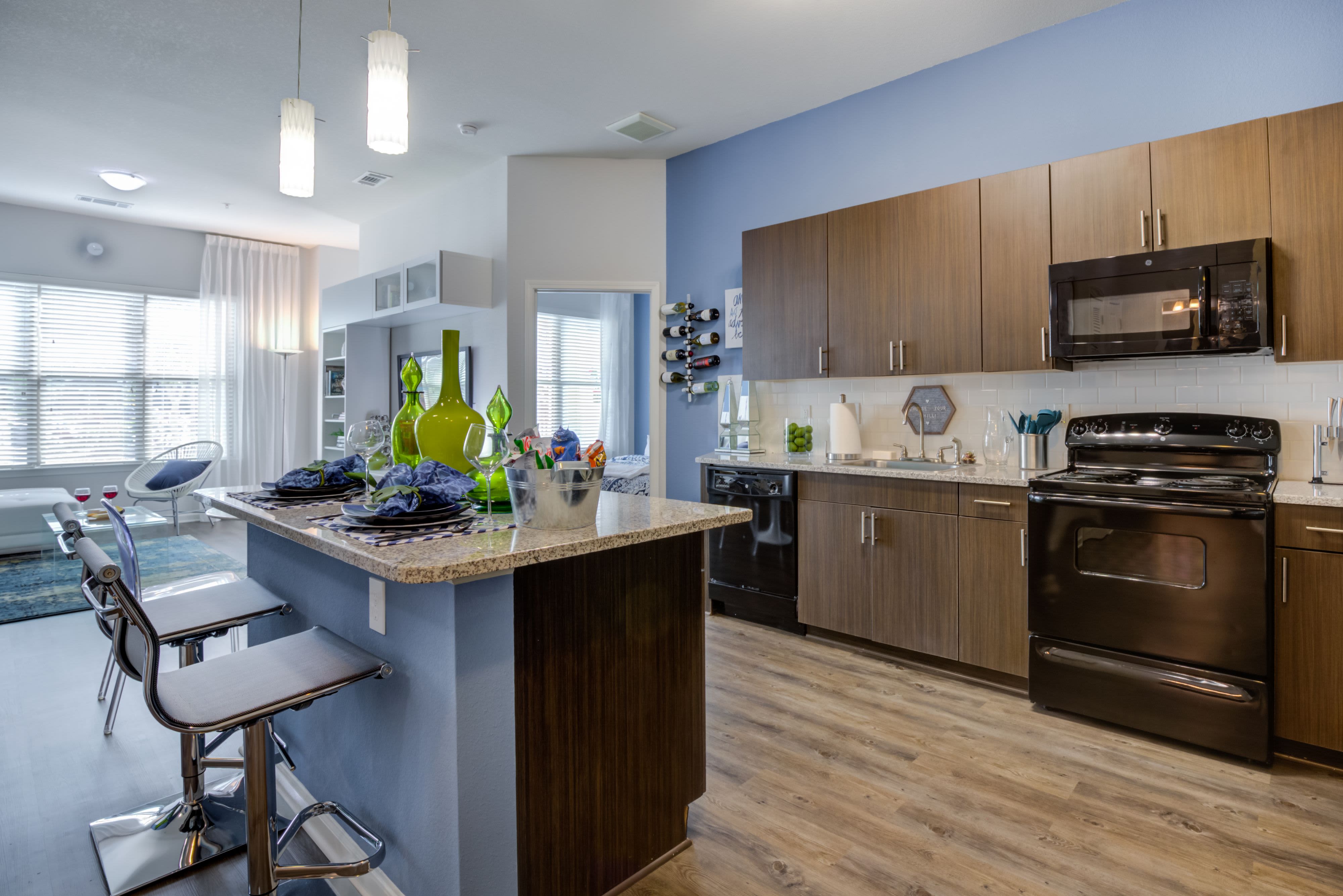 Kitchen with chef's island at Celsius Apartment Homes in Charlotte, North Carolina