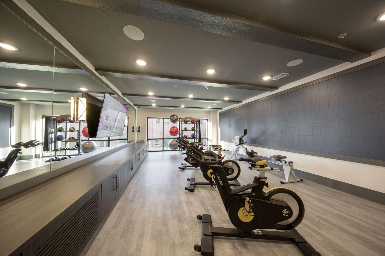 Yoga studio with stationary bikes and a rowing machine at Steelyard in Oklahoma City, Oklahoma