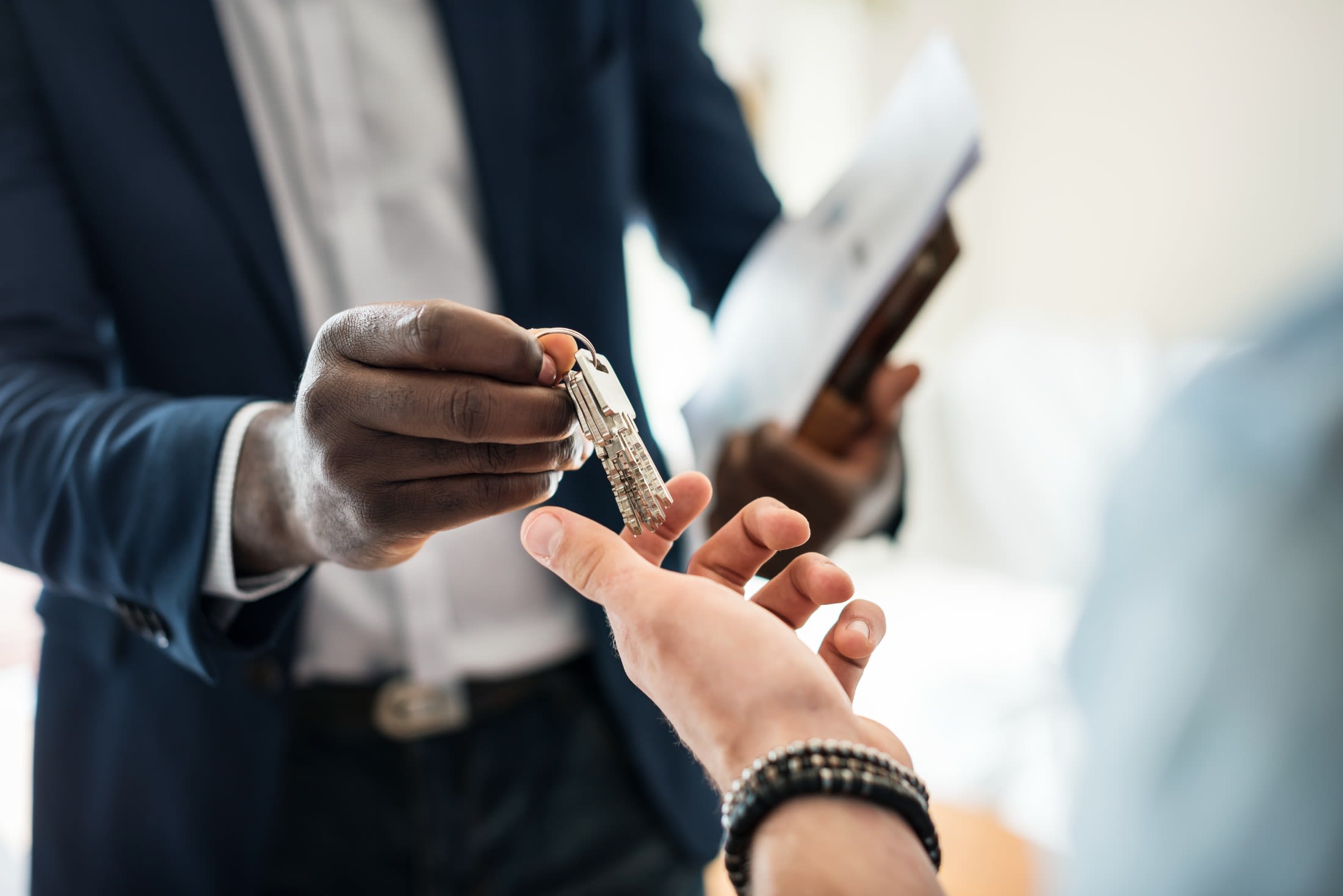 Management handing keys to resident at Wadsworth Shores in Virginia Beach, Virginia