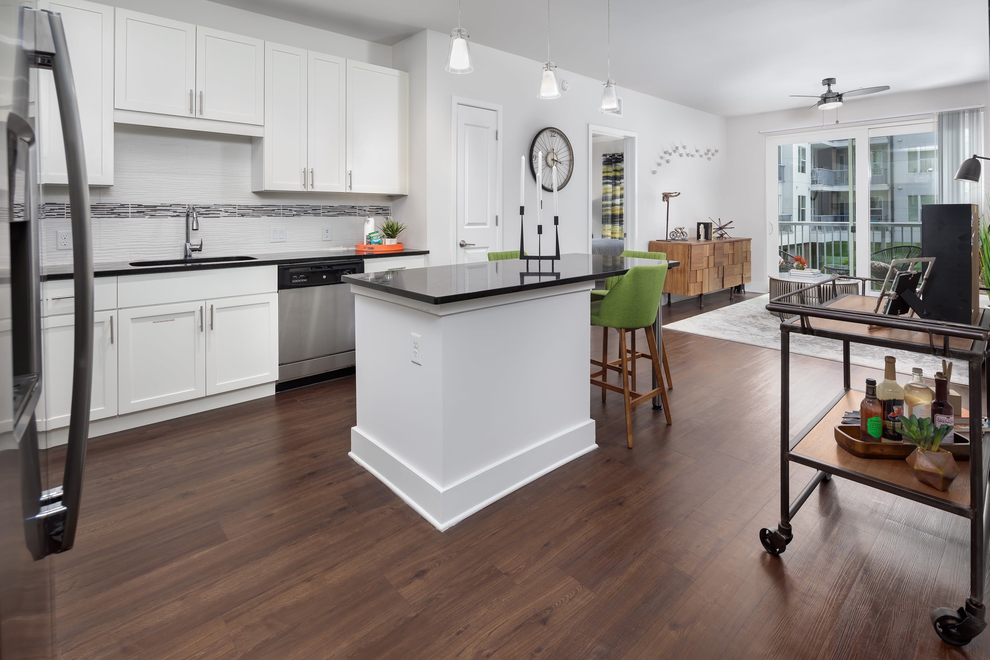 Kitchen with stainless steel appliances and granite style countertops at Central Station on Orange in Orlando, Florida